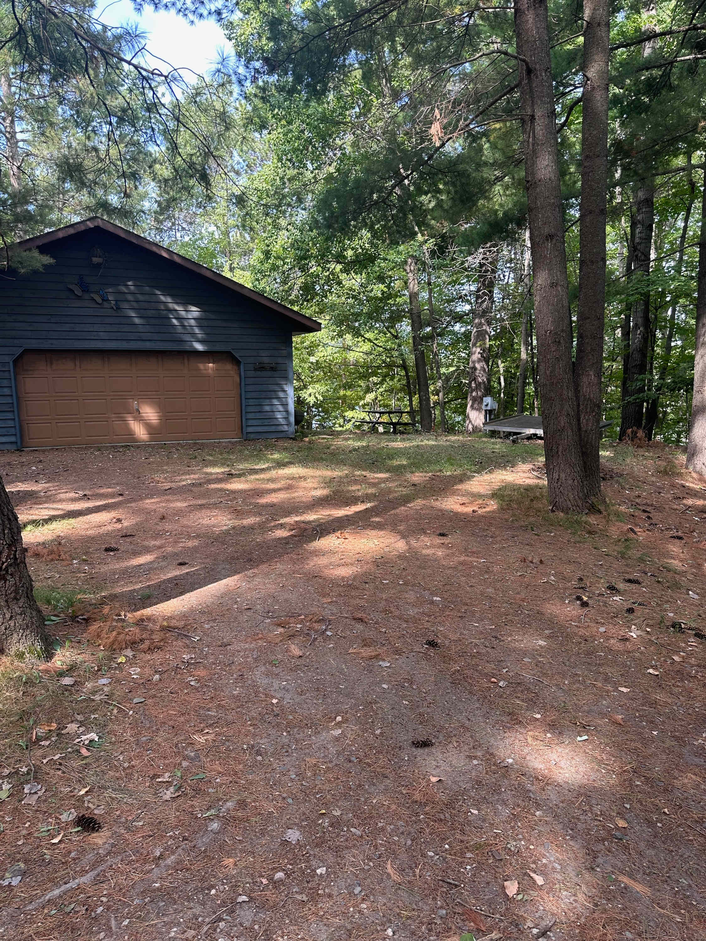 View of property. No garage access. You may camp or park anywhere near the garage. All RVs and cars must be parked in driveway.