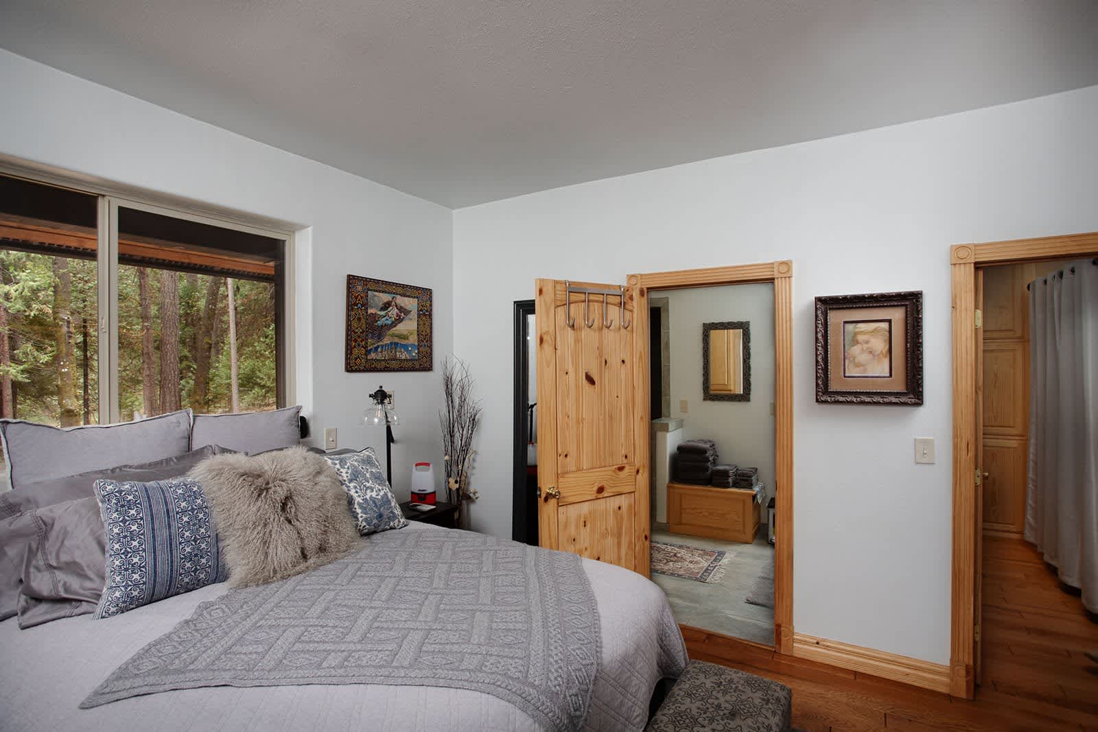 The master en suite bathroom can be accessed via the bedroom or the main hallway off the entryway. 