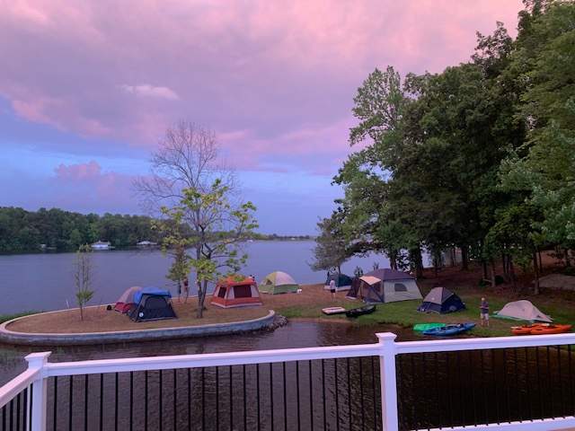View of tents on the pointe and beach area from the dock second level