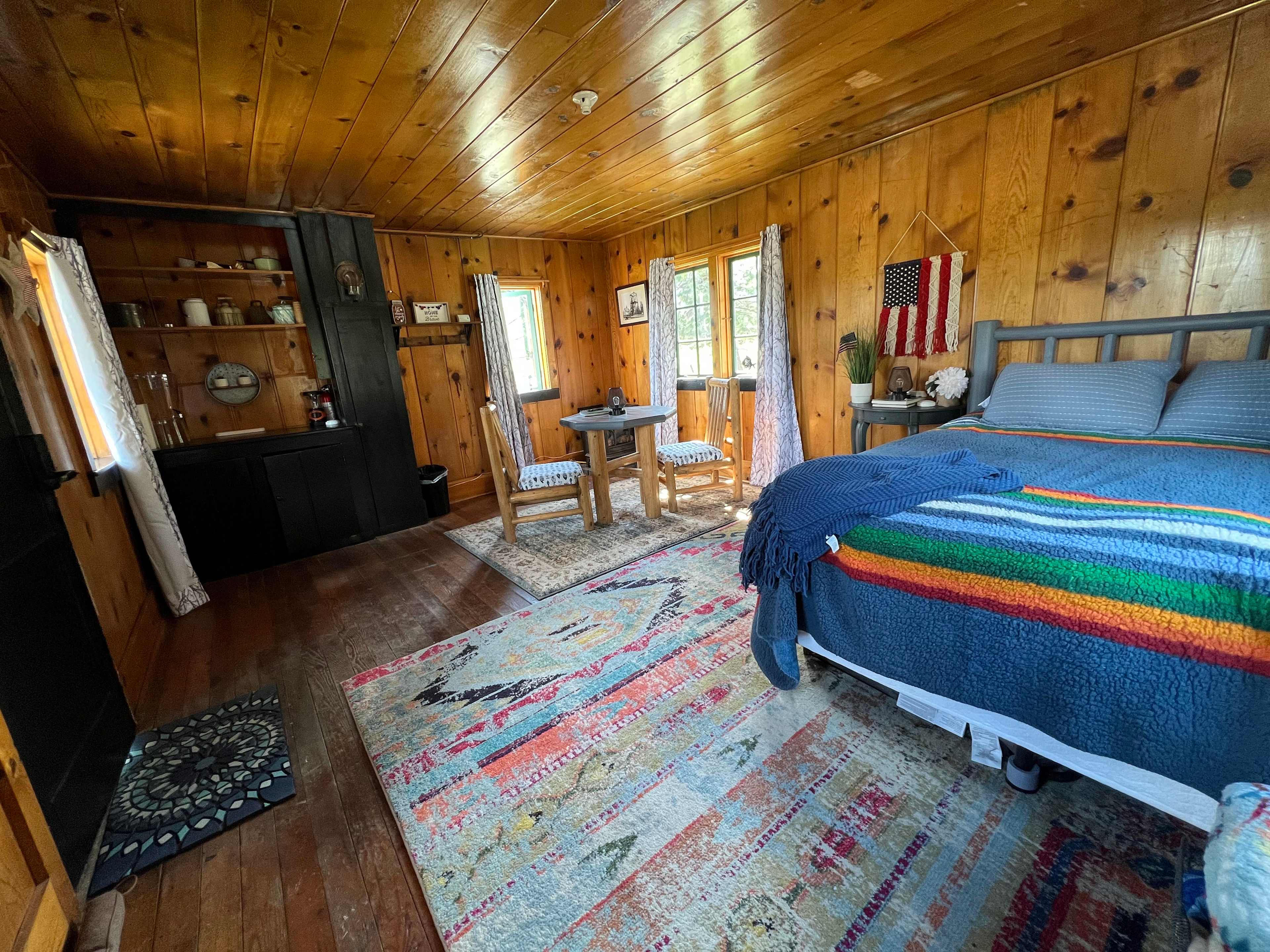 Queen bed, table and chairs and propane heat! Solar and battery operated lighting for a cozy stay!