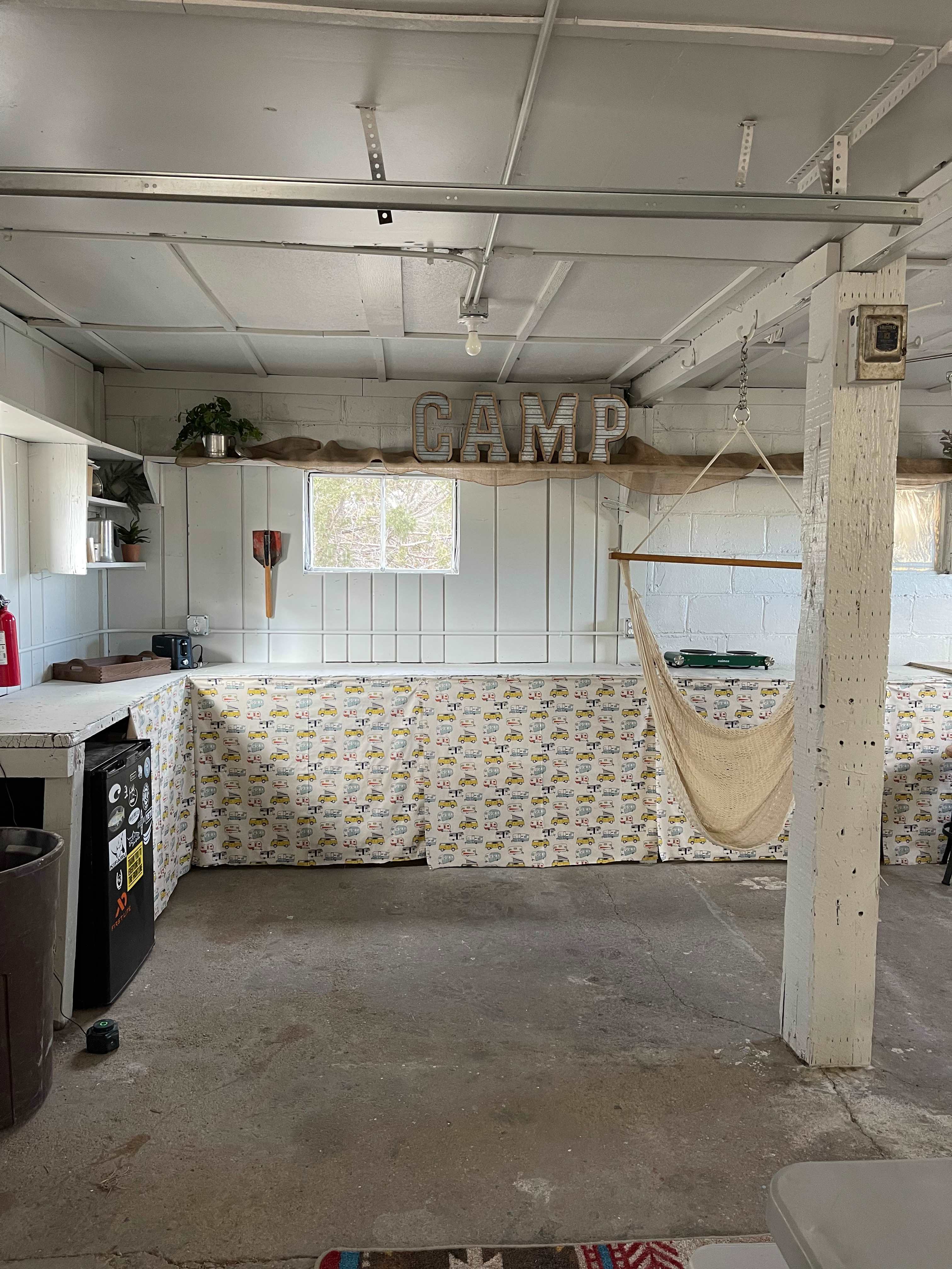 Refurbished interior for shelter.  Toaster, water for drinking or cooking and electric cook top