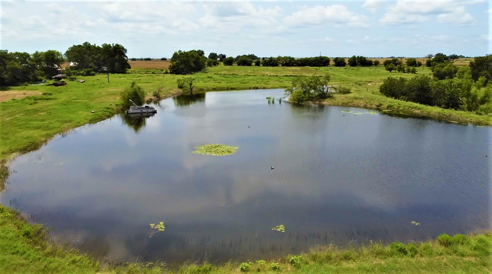 Campsites to the left of pond.
