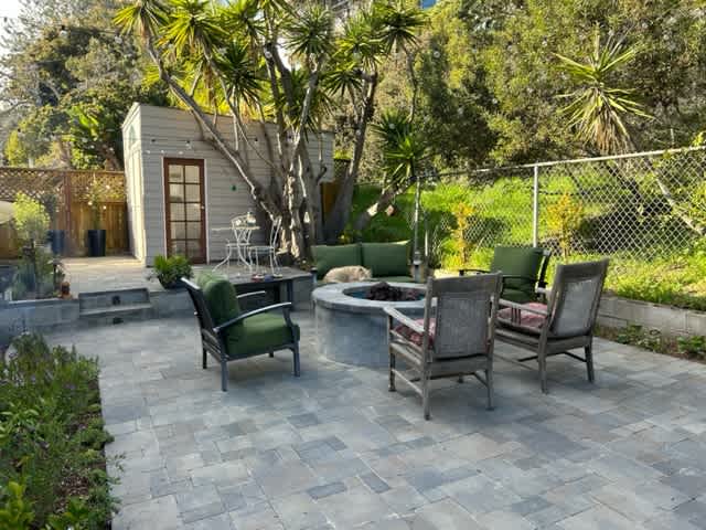 this is your cottage with an outside seating area with a gas firefeature