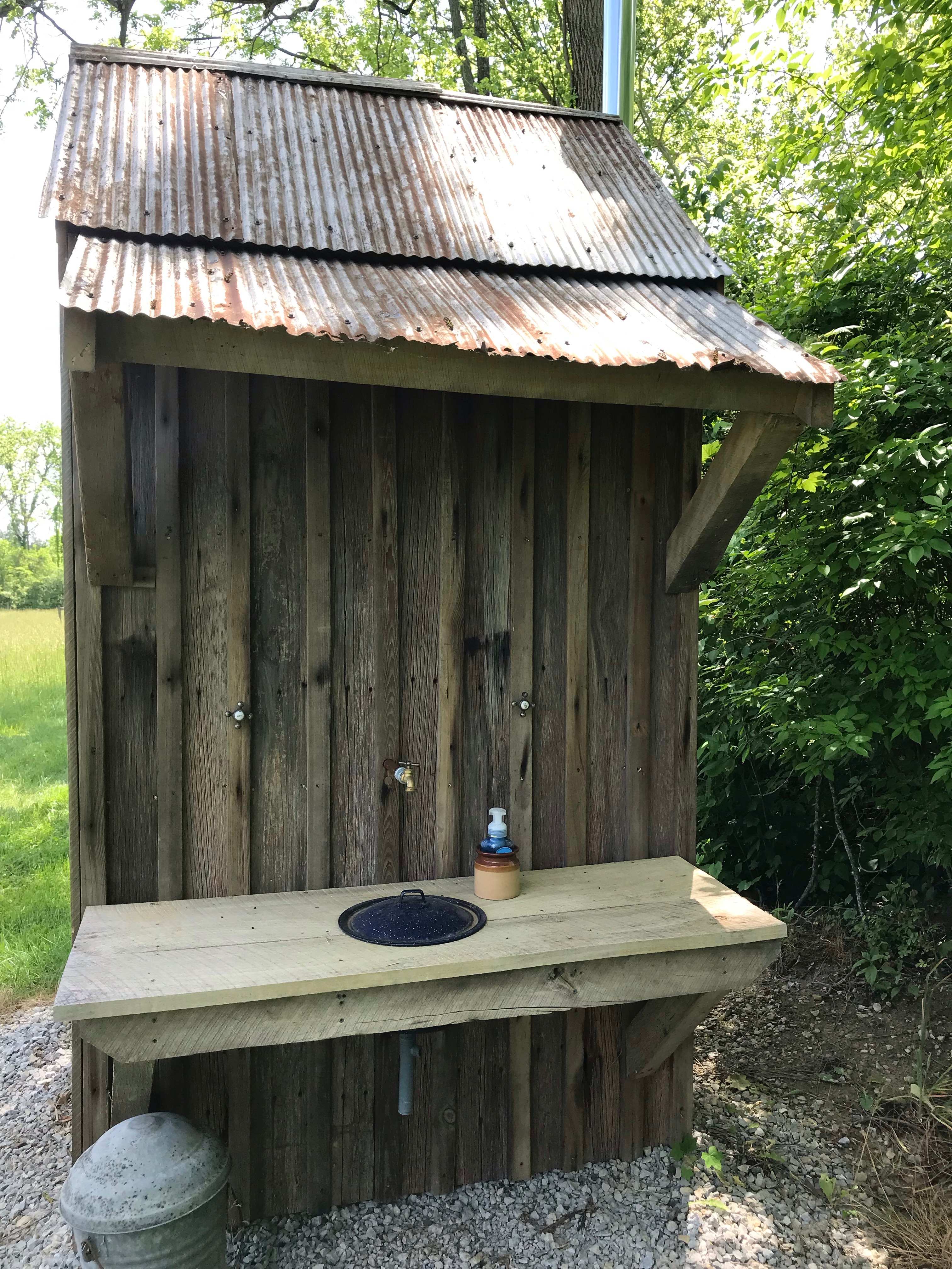 Outhouse sink. Soap and toilet paper provided.