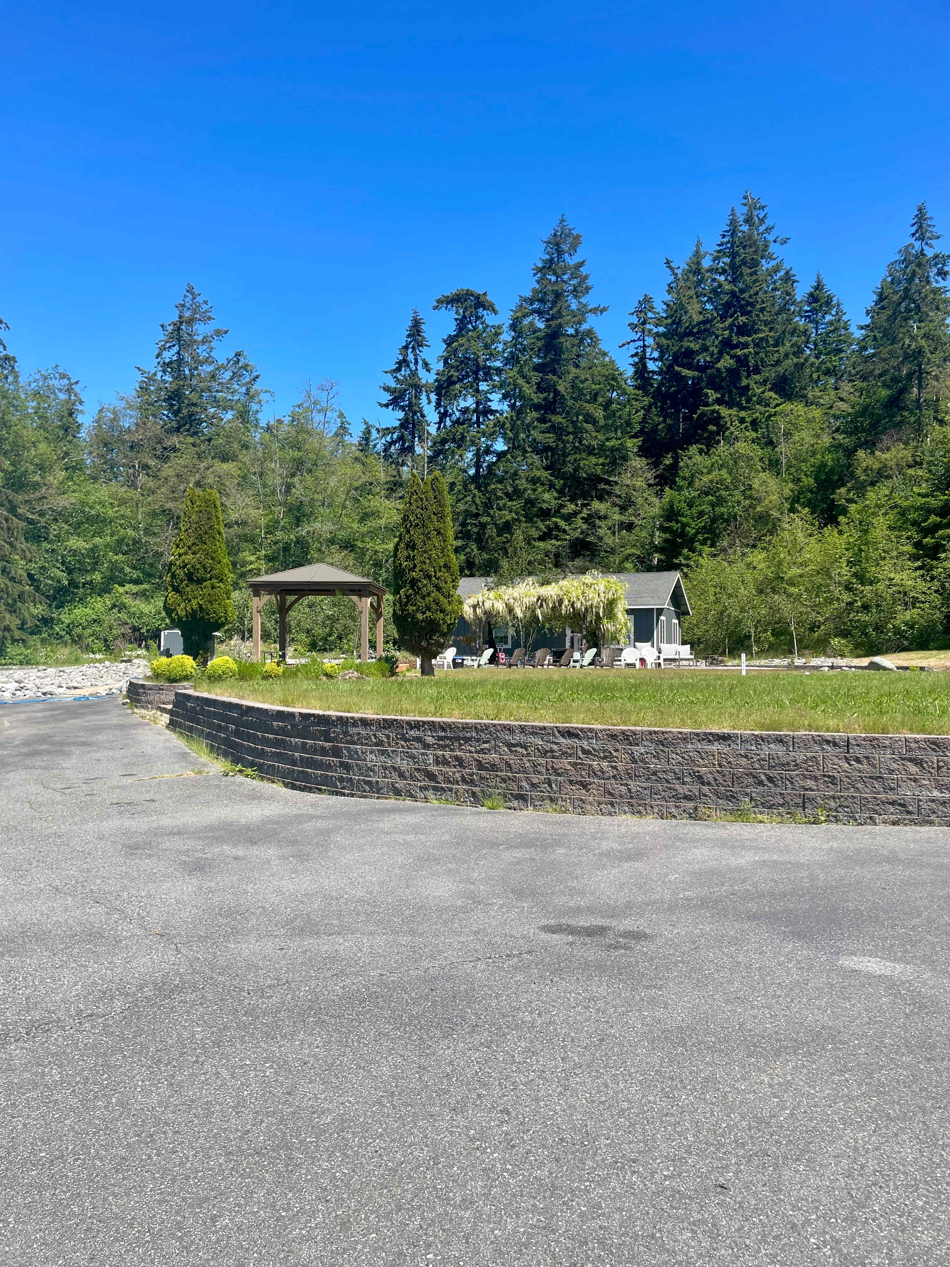 Paved RV site with water and 30 amp electrical hookups, located on the upper part of the property (approximately 100 feet from main house)