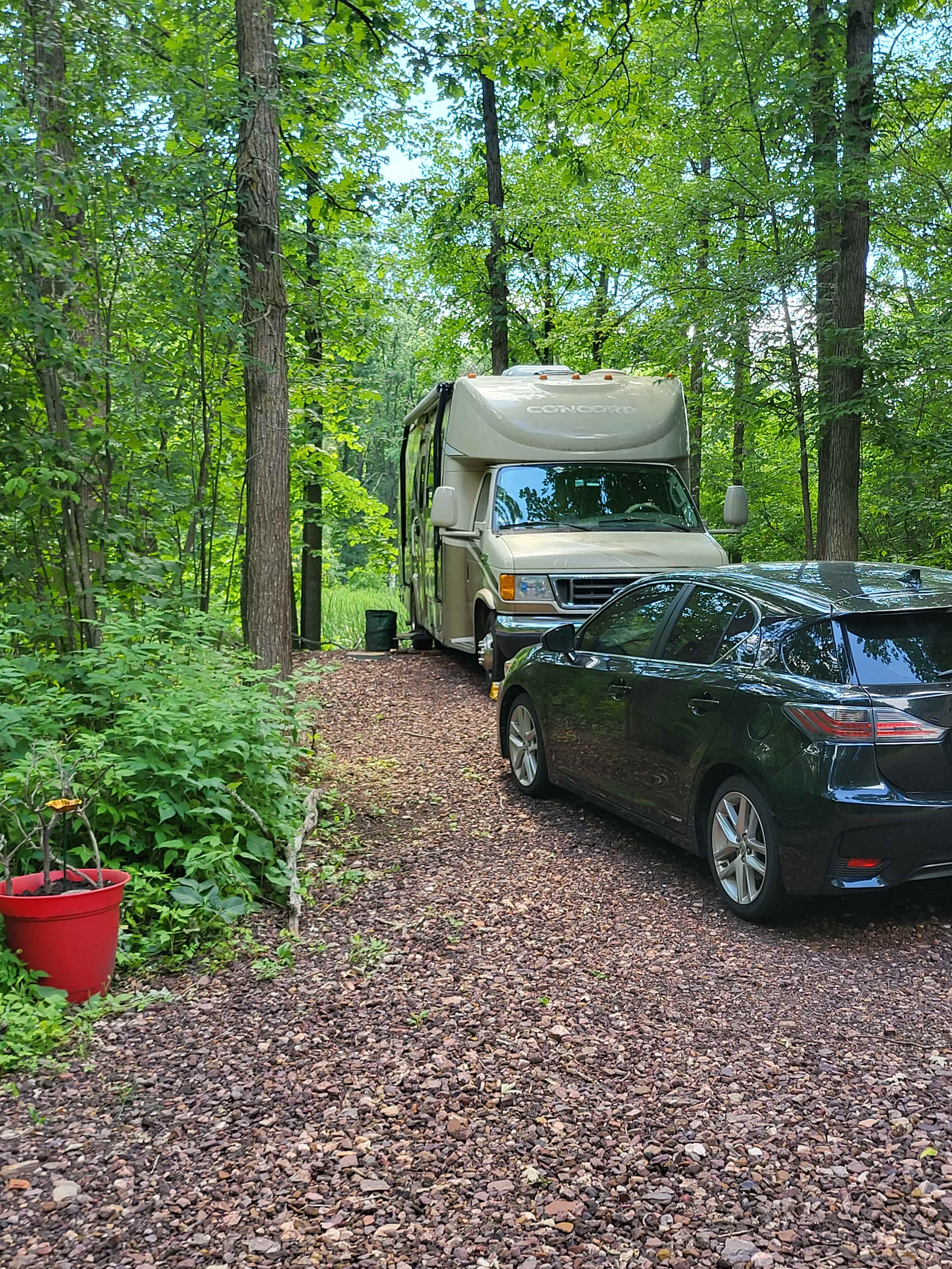 Example of an RV and Car to demonstrate the size of the site. RV here is 30 feet. 