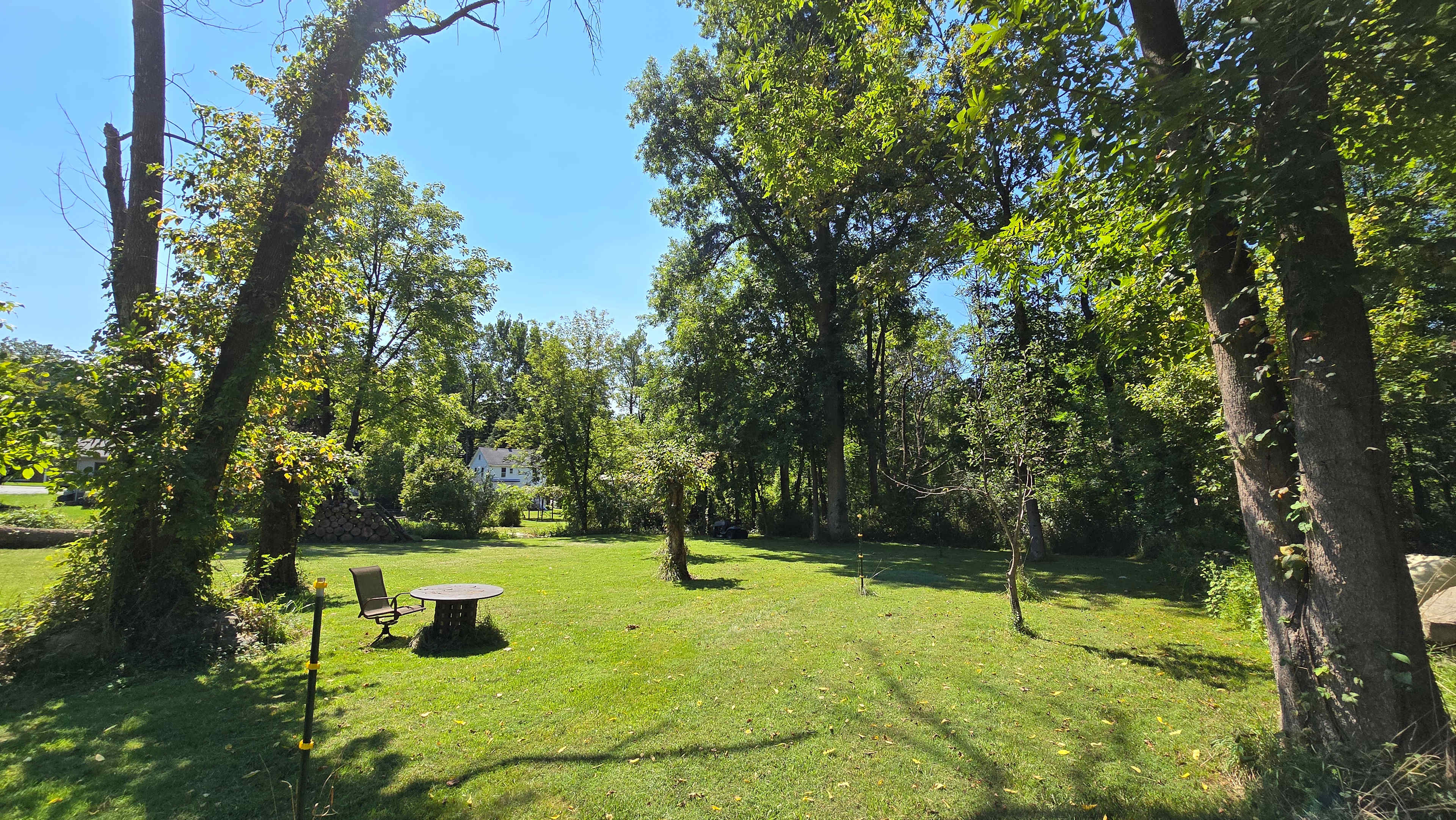 Site 4 for tents only.  40'x40' Set back with the most privacy. You can see the main house in the photo. There is a fire pit and table and chairs. 