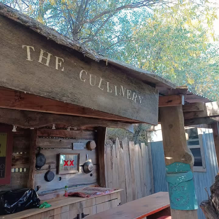 THE CULINARY. You can see one side of the Snuggery behind the tall post. The Snuggery's window opens up to the kitchen!
