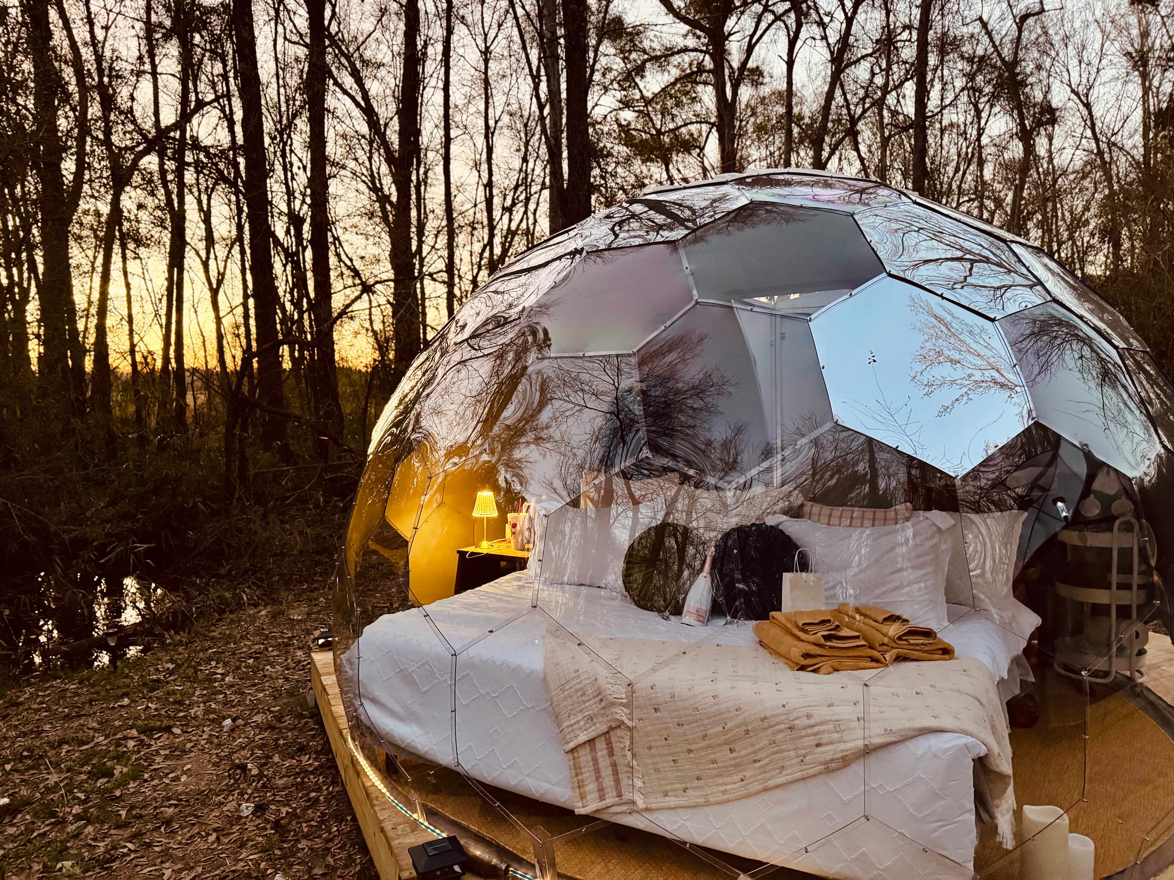 View of the Mirror Geodesic Nature dome at early sunset. 