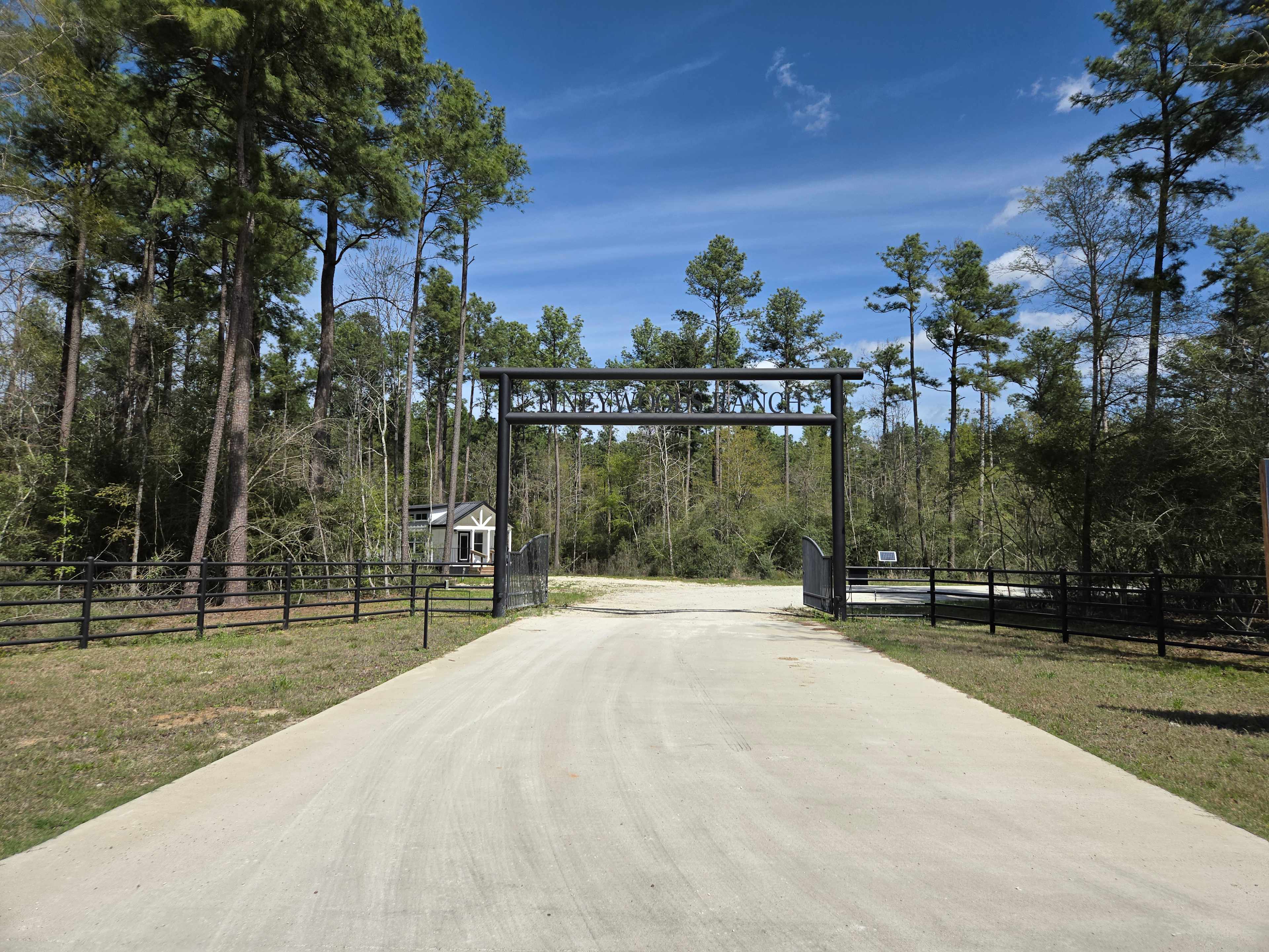 Main entrance into the community. Pineywoods Ranch