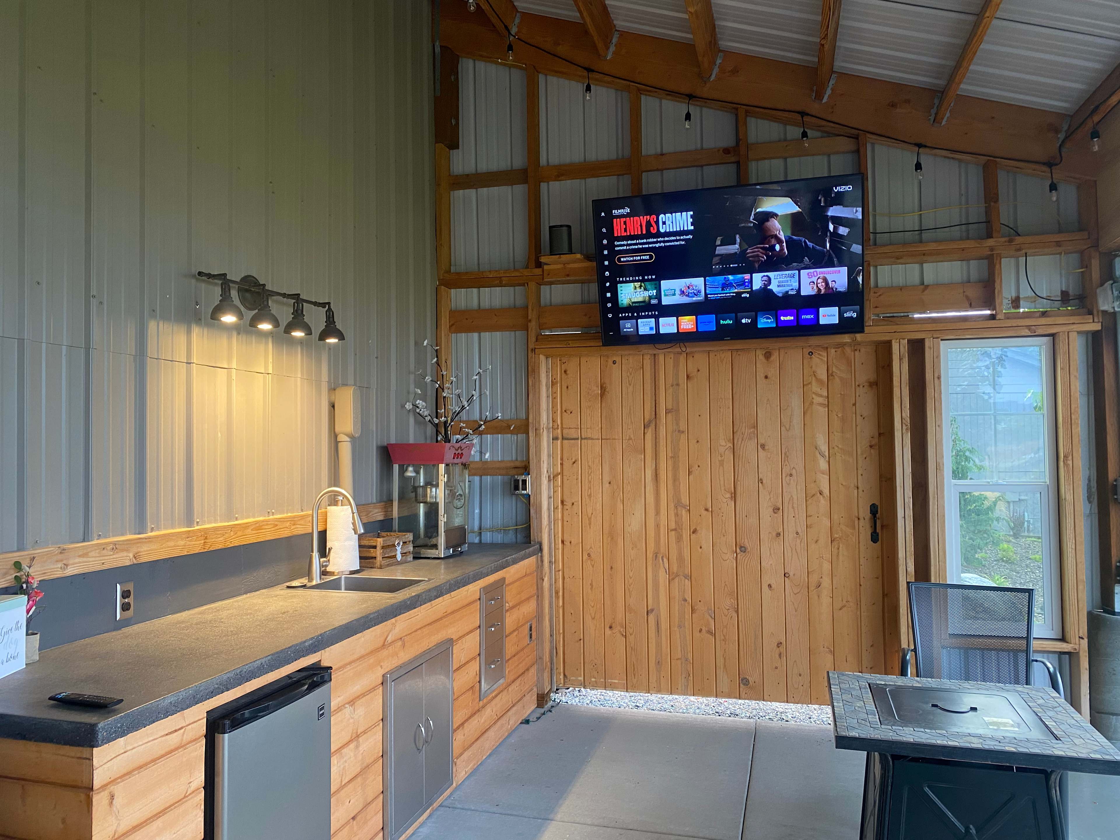 Kitchen Galley with sink, refrigerator and TV.