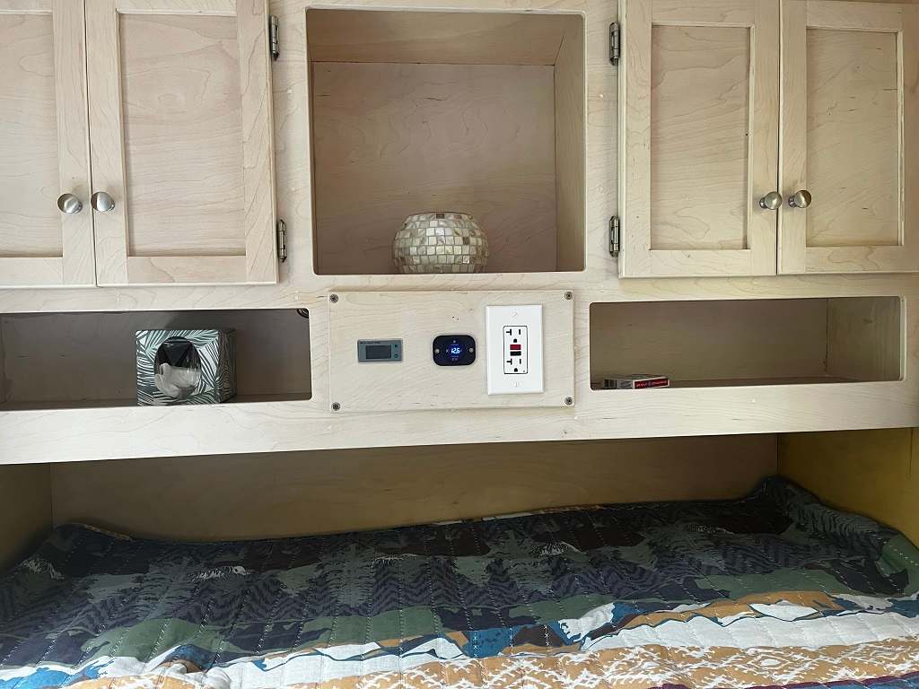 This is the foot end of the sleeping space. cubbies for belongings, usb ports and lighting.