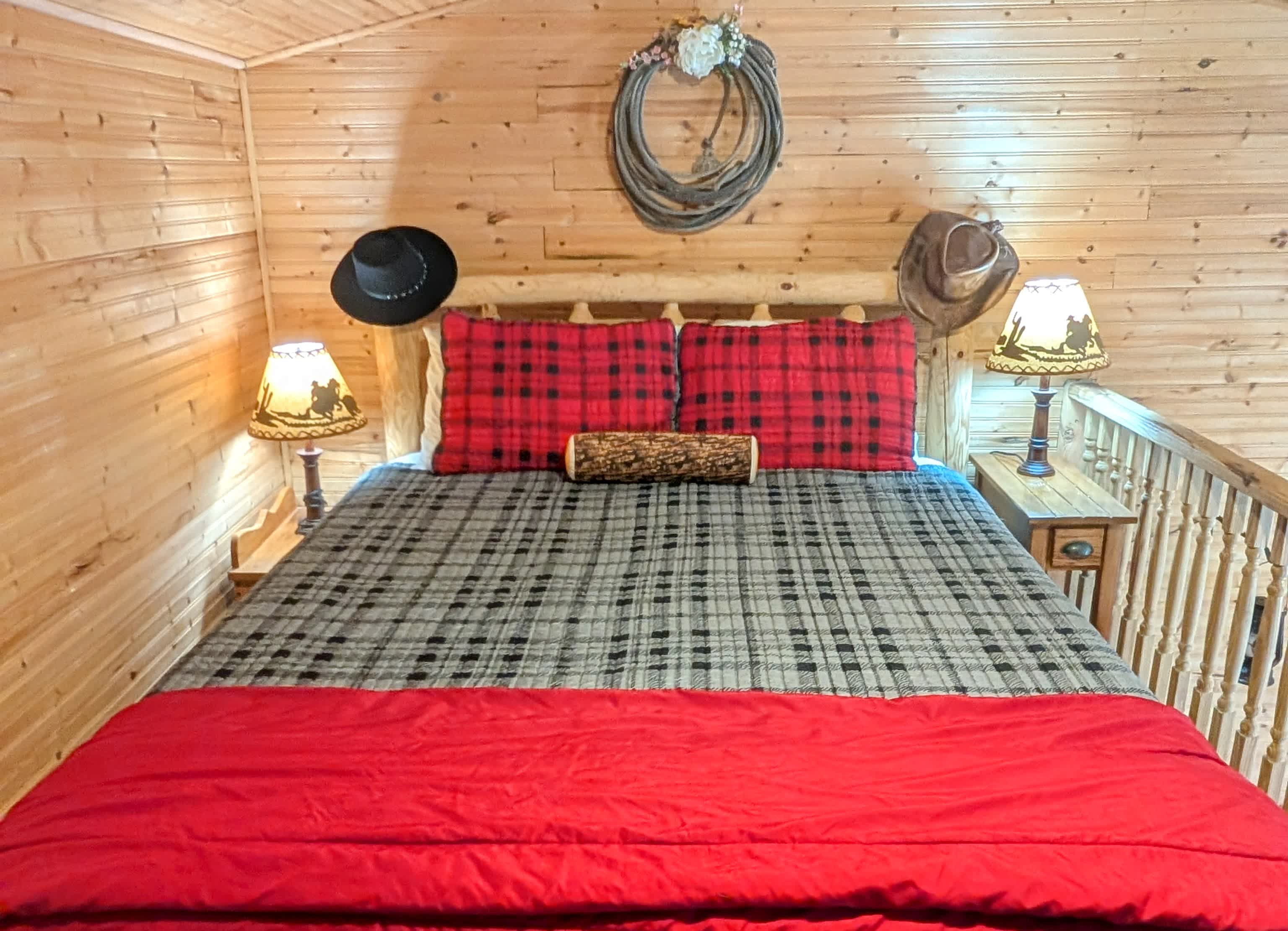 Primary bedroom.  Sleeping loft.  Queen memory foam, UGG bedding.  6 ft. adult can comfortably stand here.  