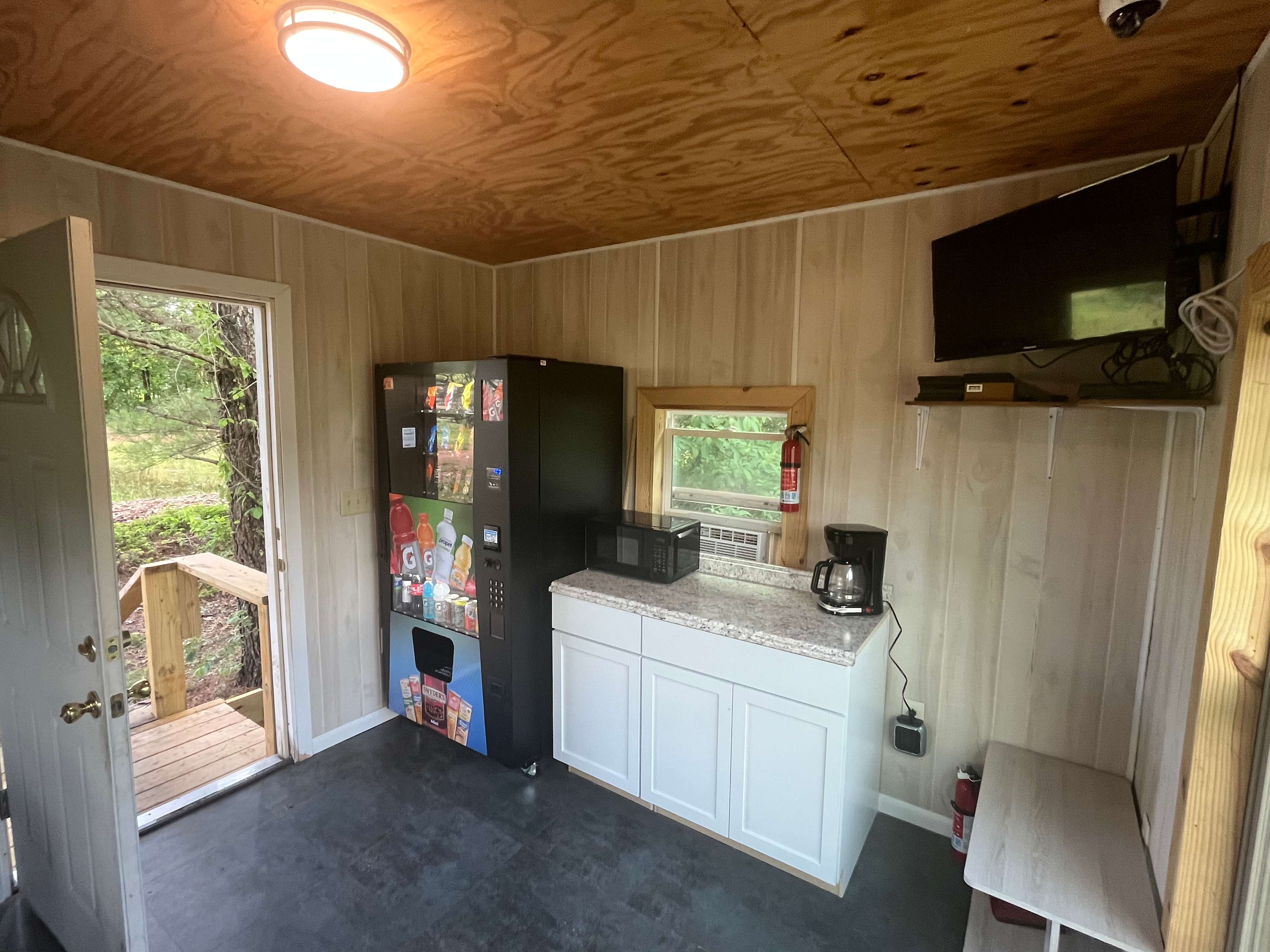 the lounge has a microwave and a vending machine where firewood and refreshments can be purchased, RV, Cabin and Tent guests