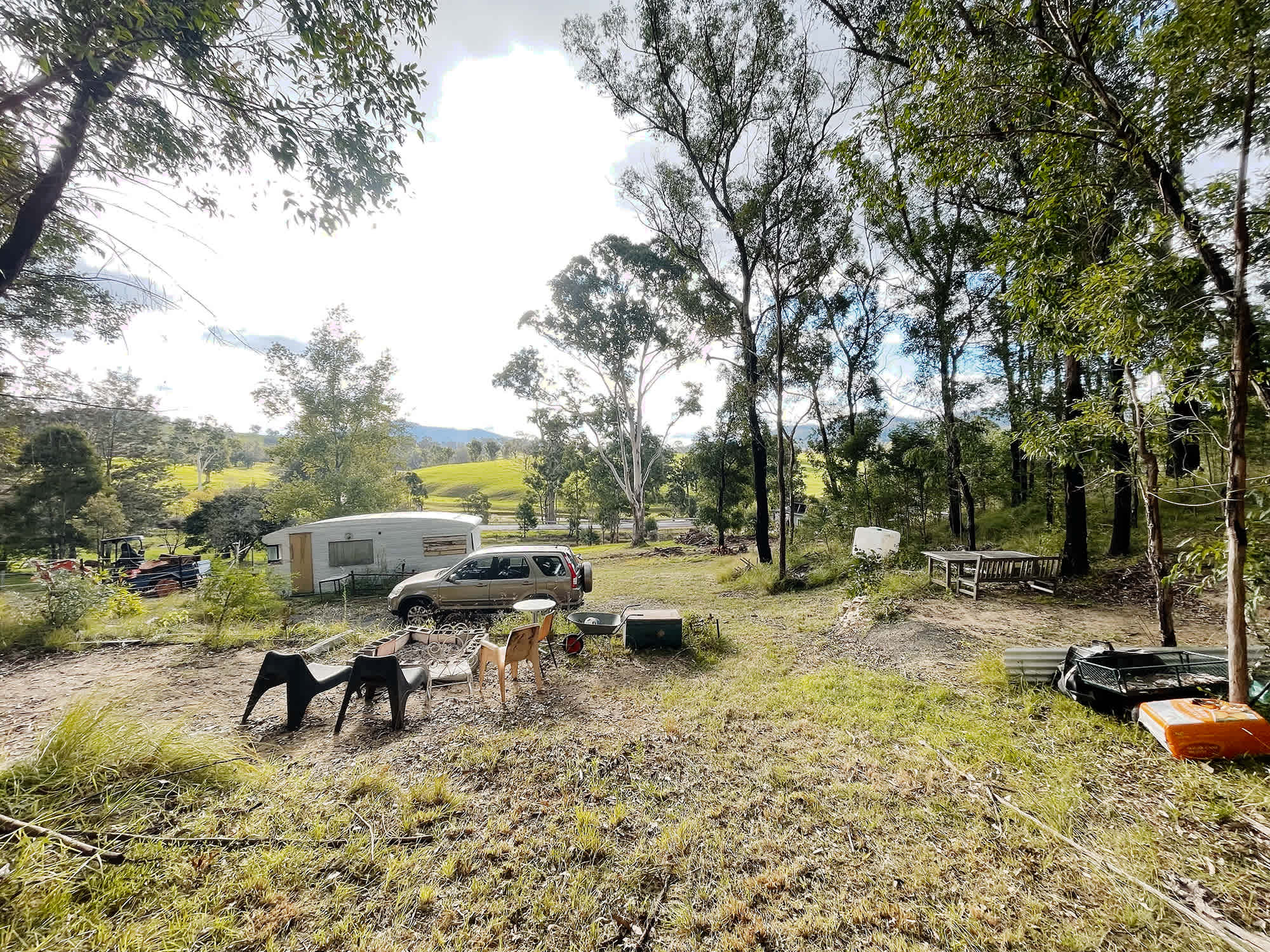 Welcome! Here you see the firepit, the main tent pad to the right and a secondary pad top to the left. Oh and the beautiful view of course :)