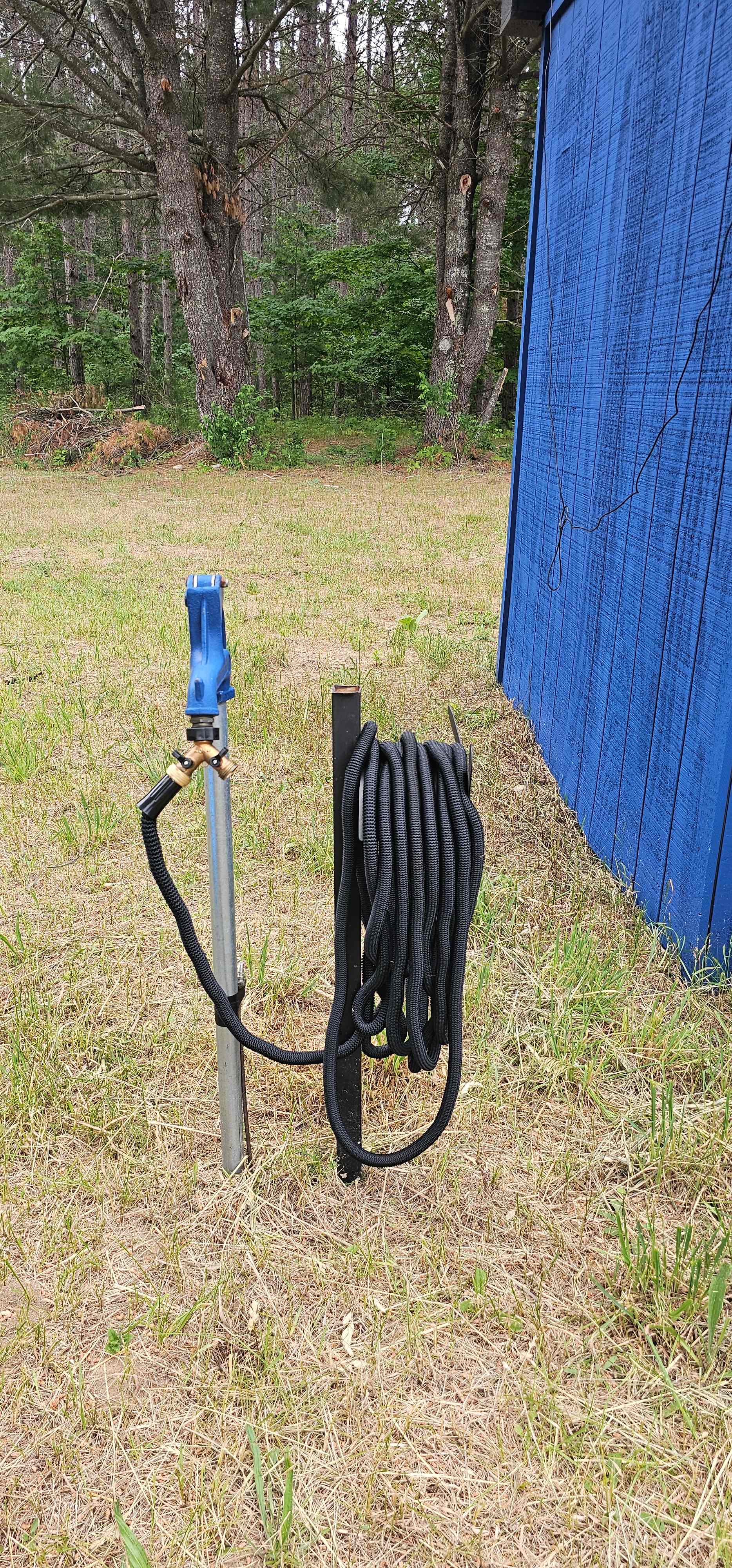 Water source to fill your tank. Please pull your camper to the large pine and run your own hose out  to fill up before parking. Please use your own hose. 