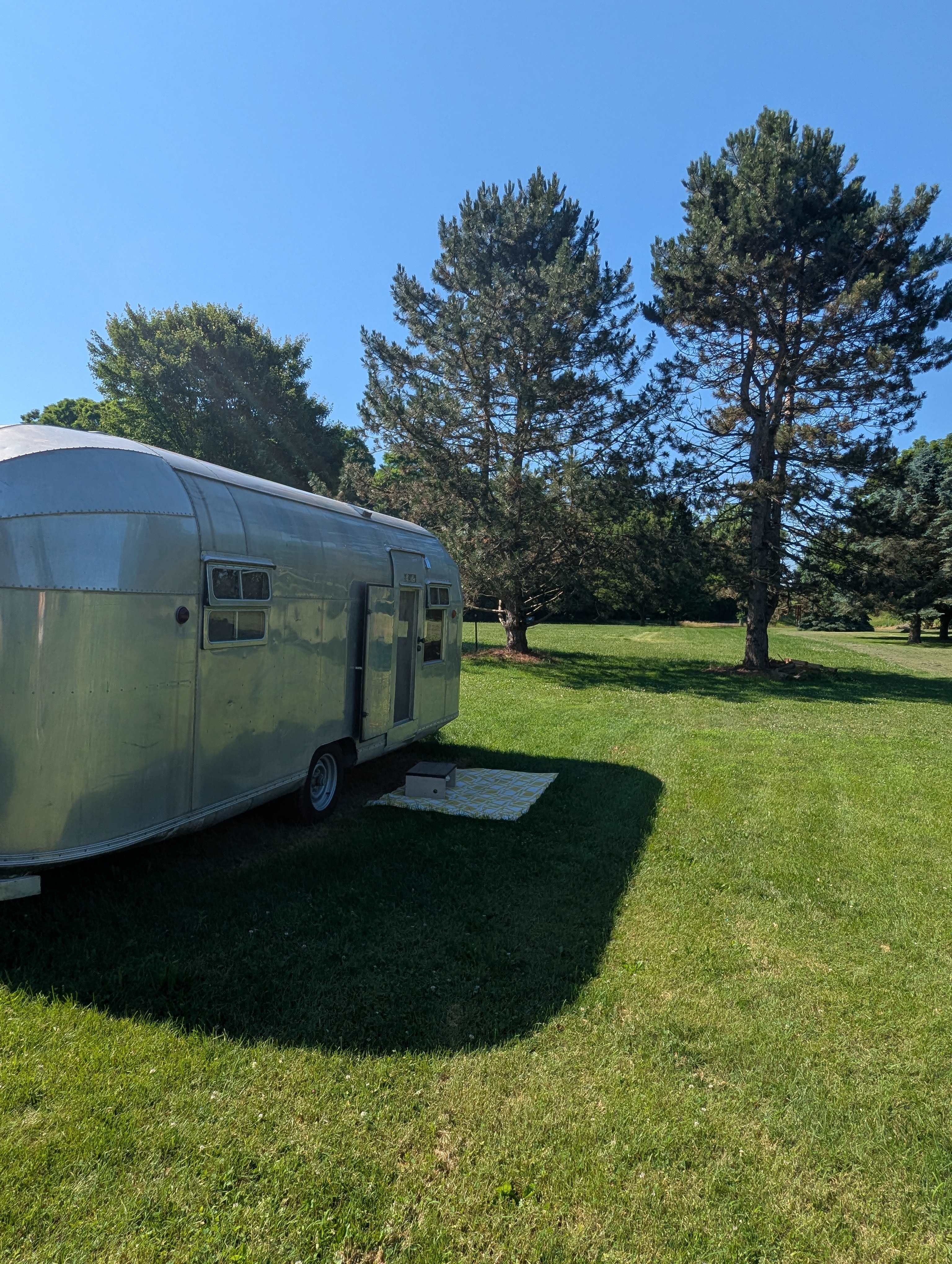 The camper sits behind our barn and is mostly private.  In August, we'll have outdoor furniture, a fire pit, & picnic table, just outside the camper.