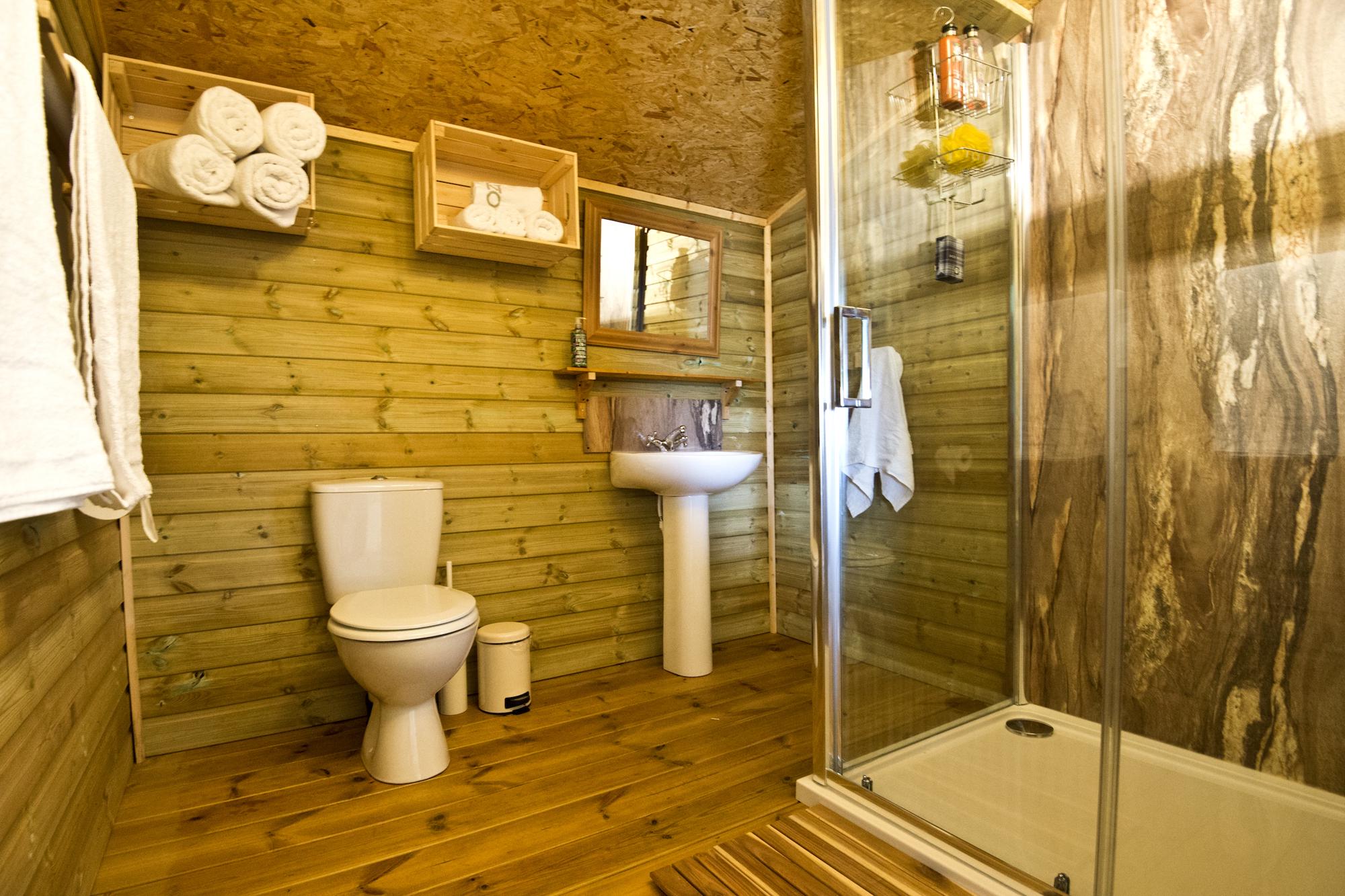 The safari lodge has two bathrooms, one with a spacious and powerful shower.