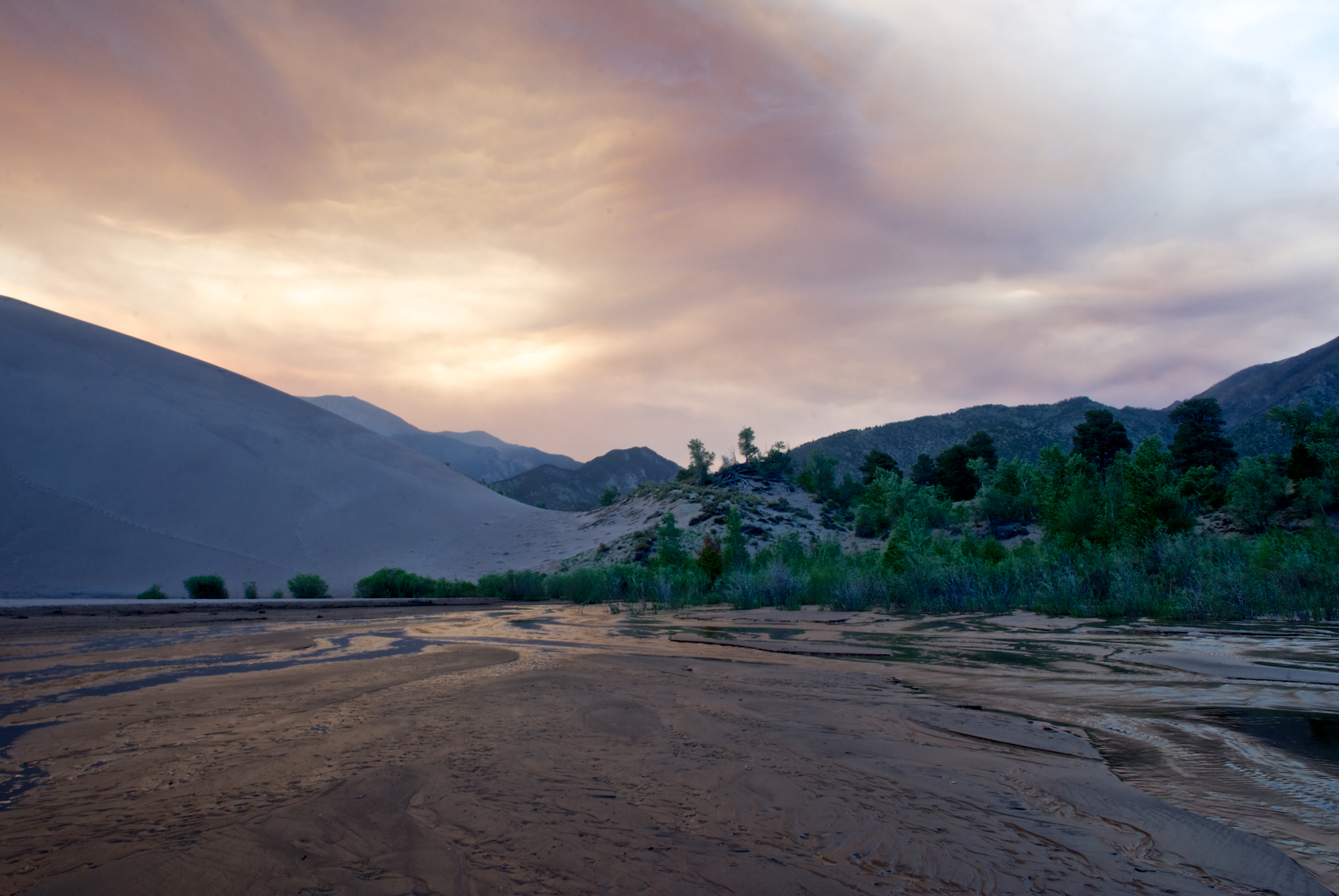 A smokey sunset because of a wildfire across the valley.