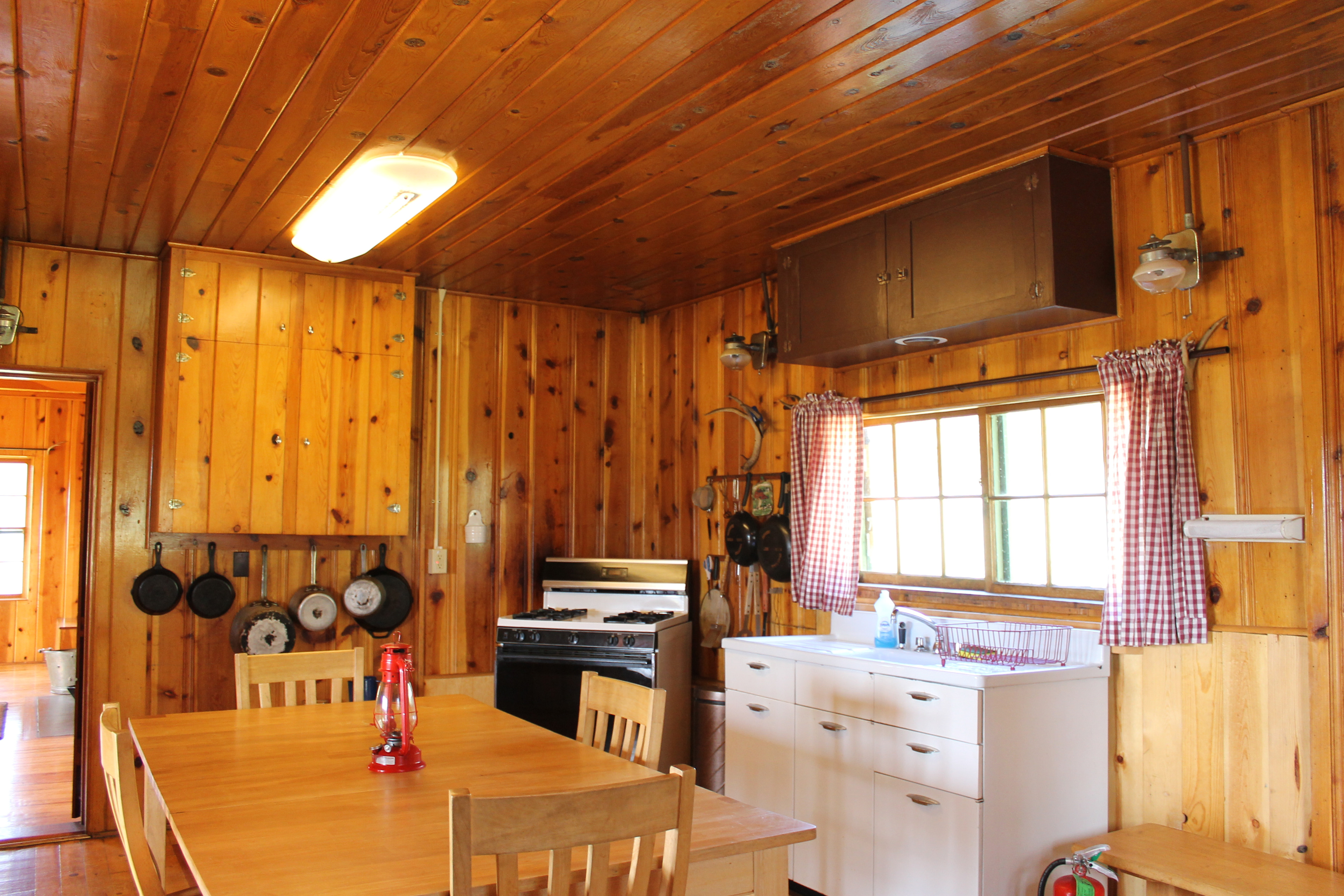 Very spacious kitchen with propane oven/stove and propane fridge. All the pots, pans, and cooking/eating utensils you could need are also included.