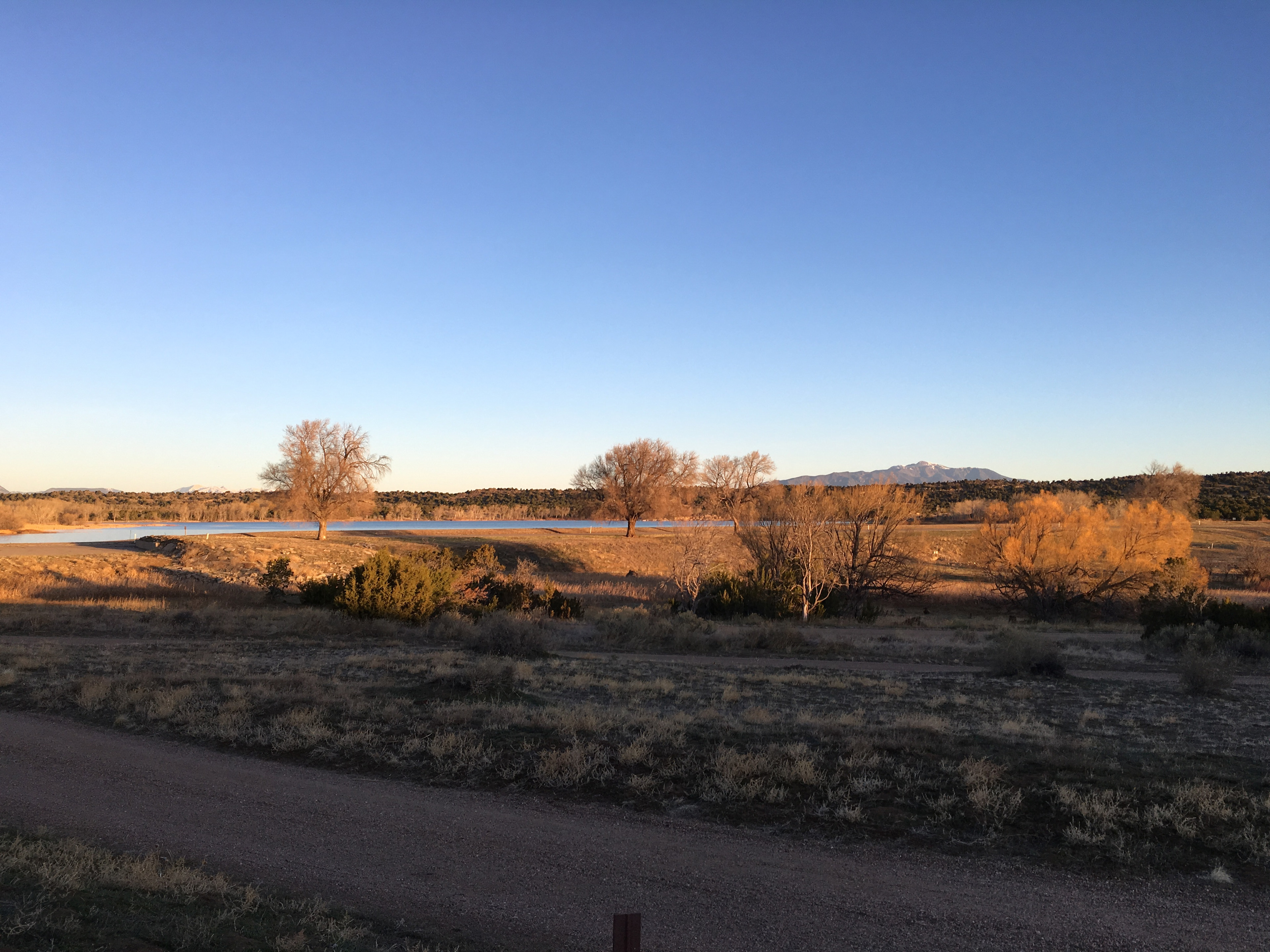 Surrounded by mountains and the lake.