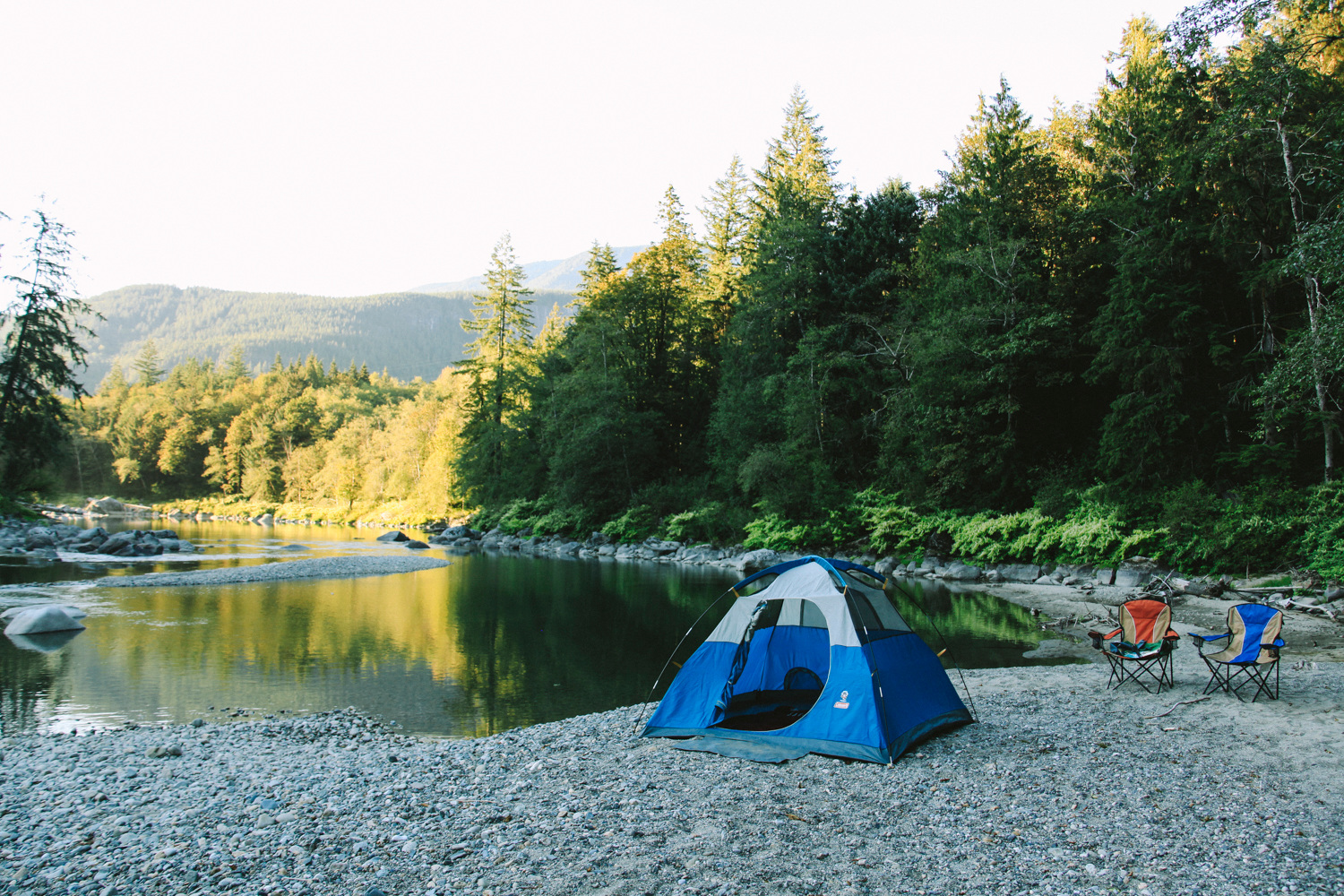 If you pitch your tent down on the landing you can see the sunset looking north over a mellow eddy in the river.