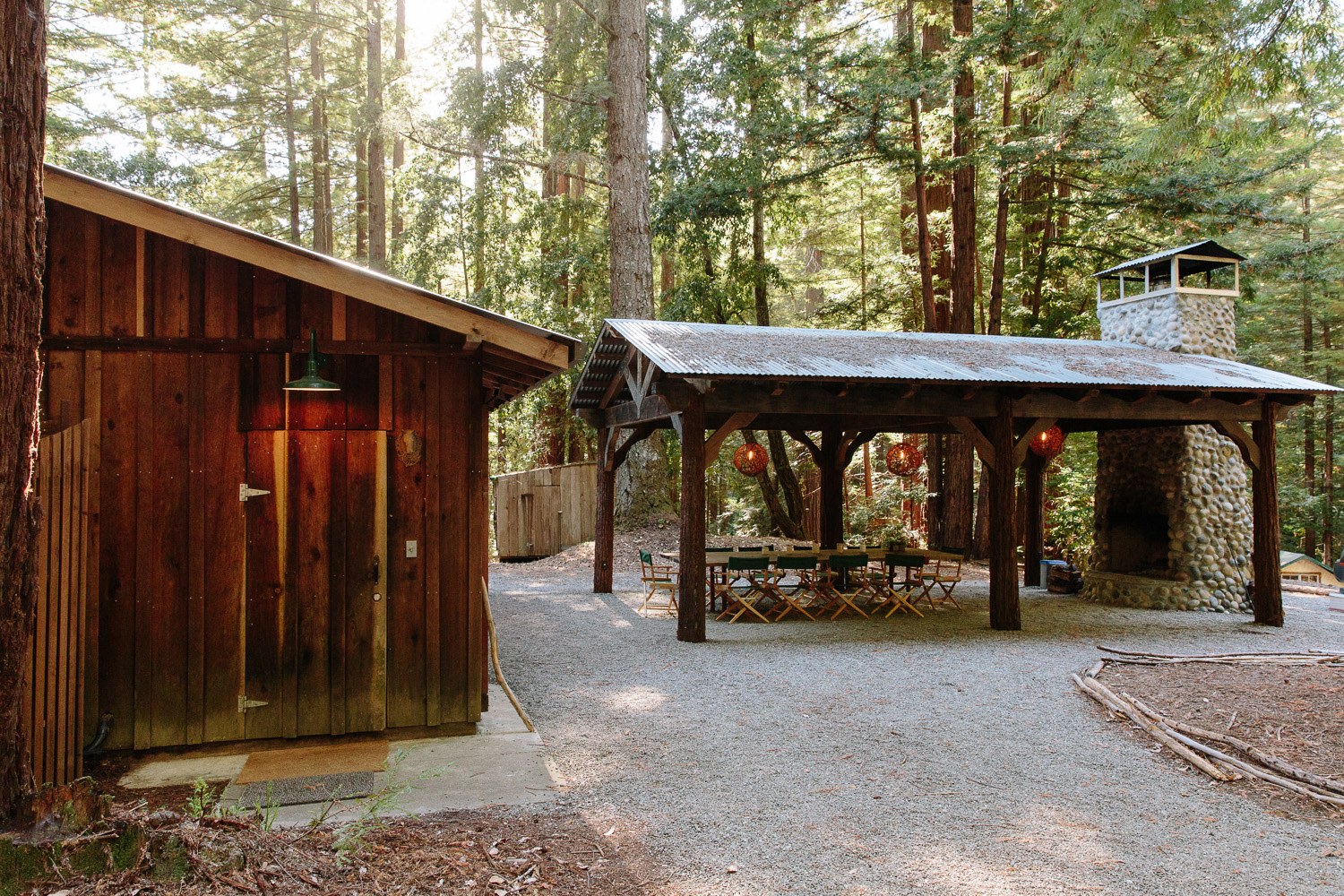 Entry to bathrooms on left side of the building, outdoor dining area
