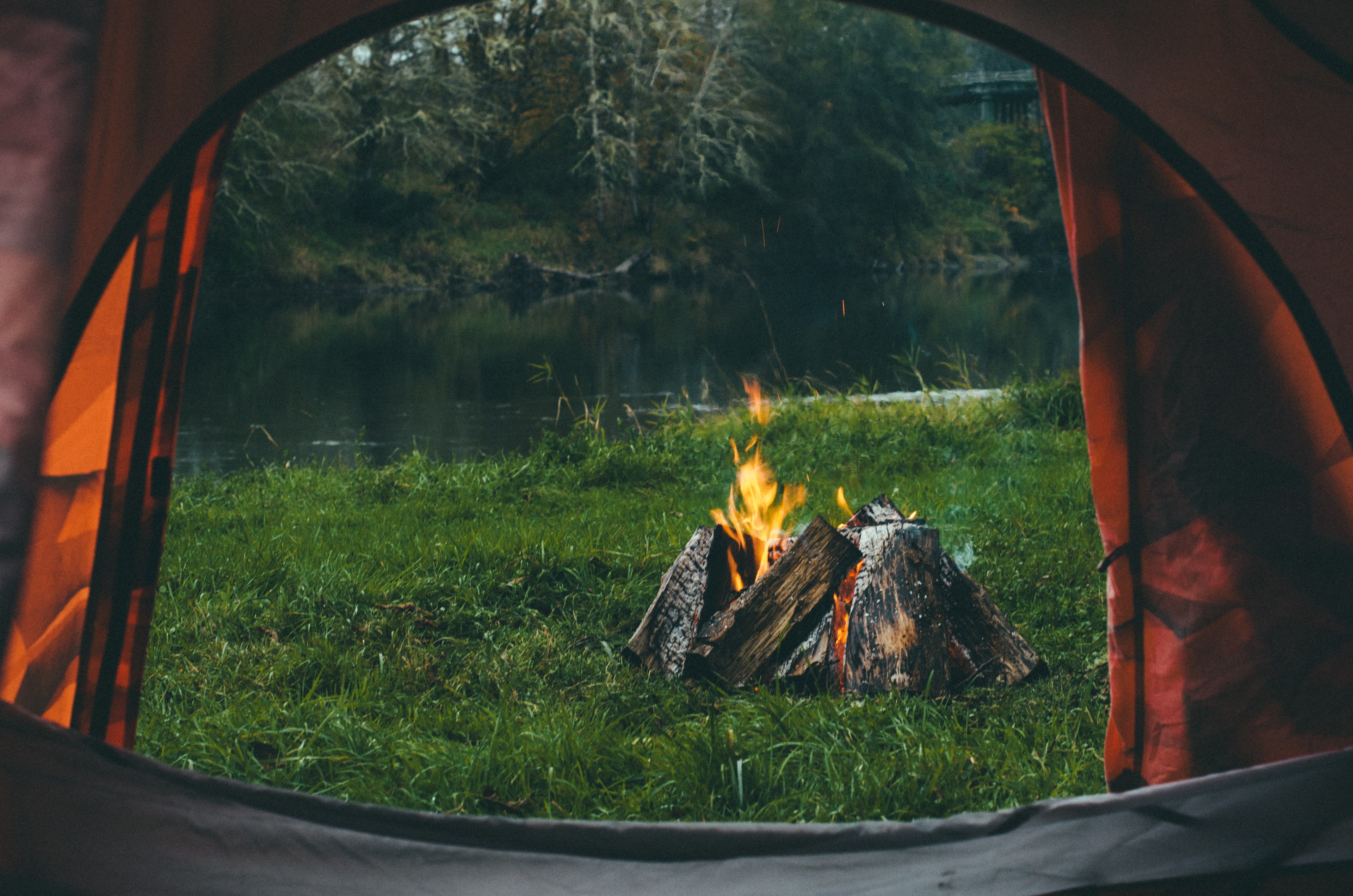 Camp vibes. Enjoying the fire from inside my tent to get out of the rain. 
