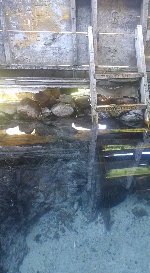 Crystal clear water with a sandy bottom.