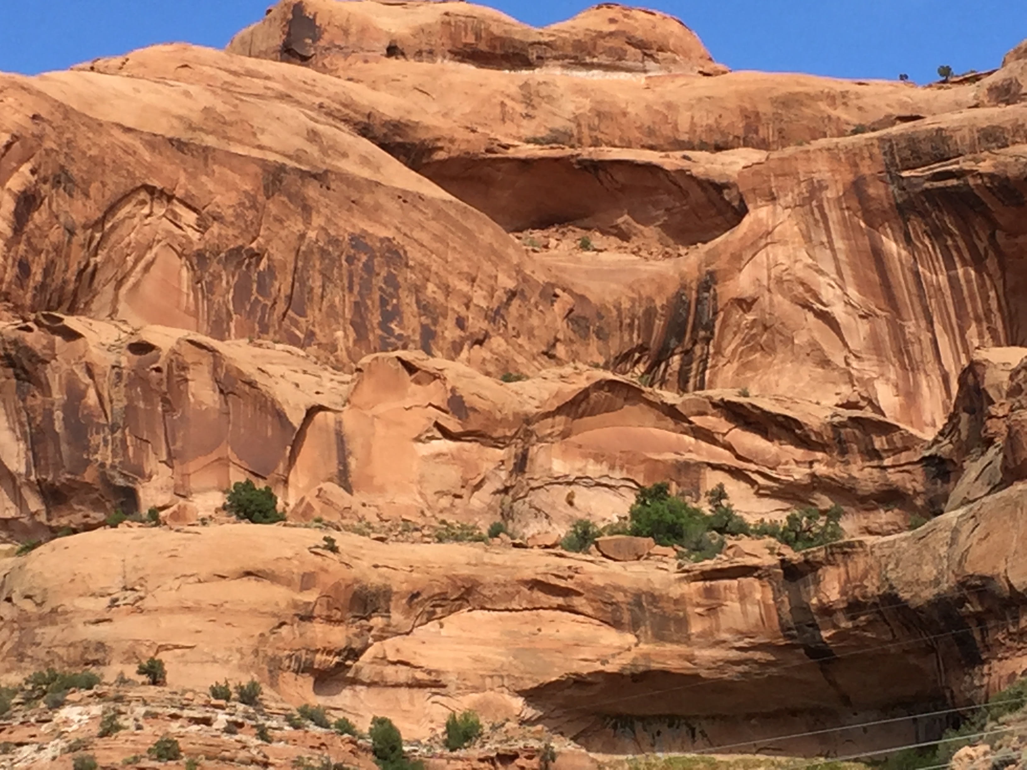 Campground views include spectacular cliffs and a small arch.