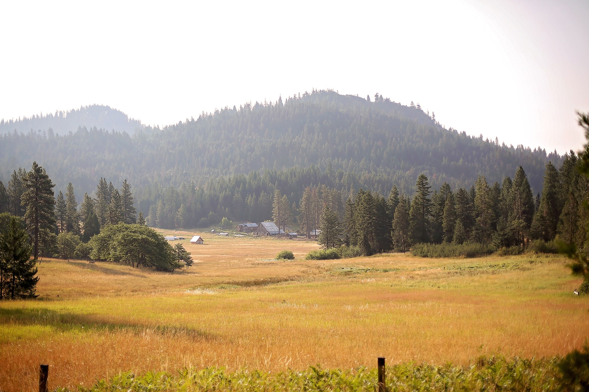 The view of the farm from a trail by the wall tents.