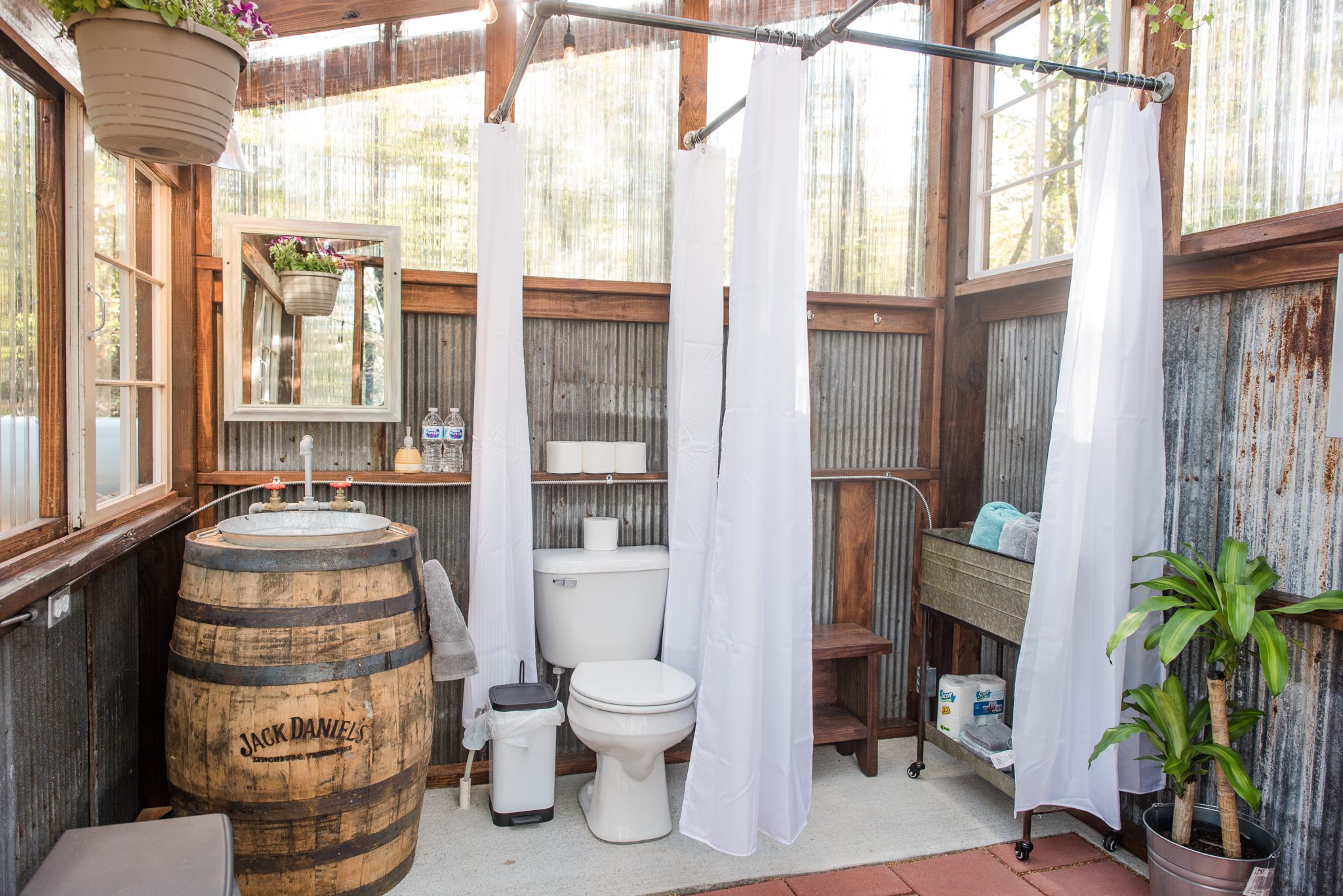 The bathroom is amazing and has a wonderful view of the woods.