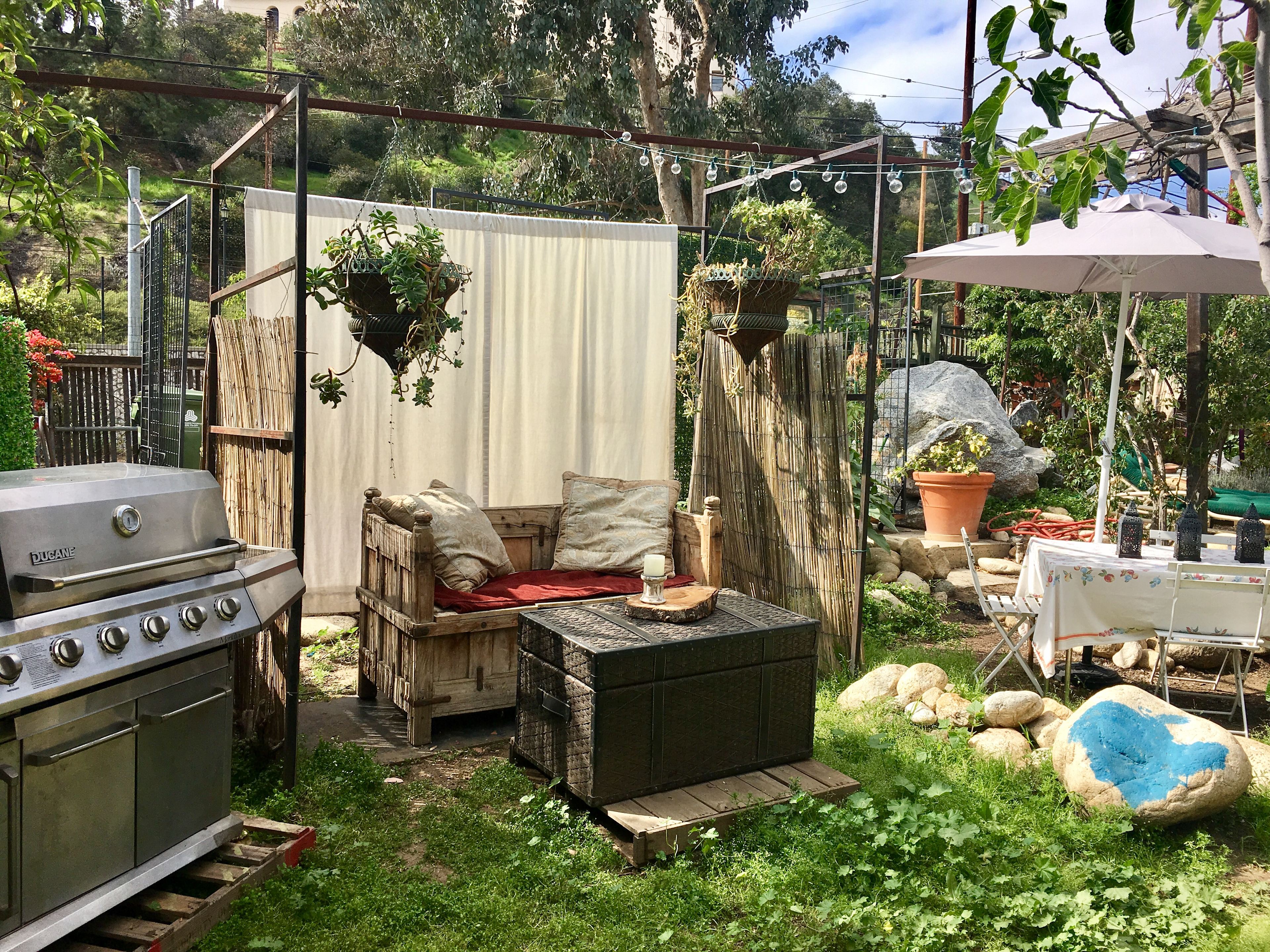Another lounging area with gas grill.