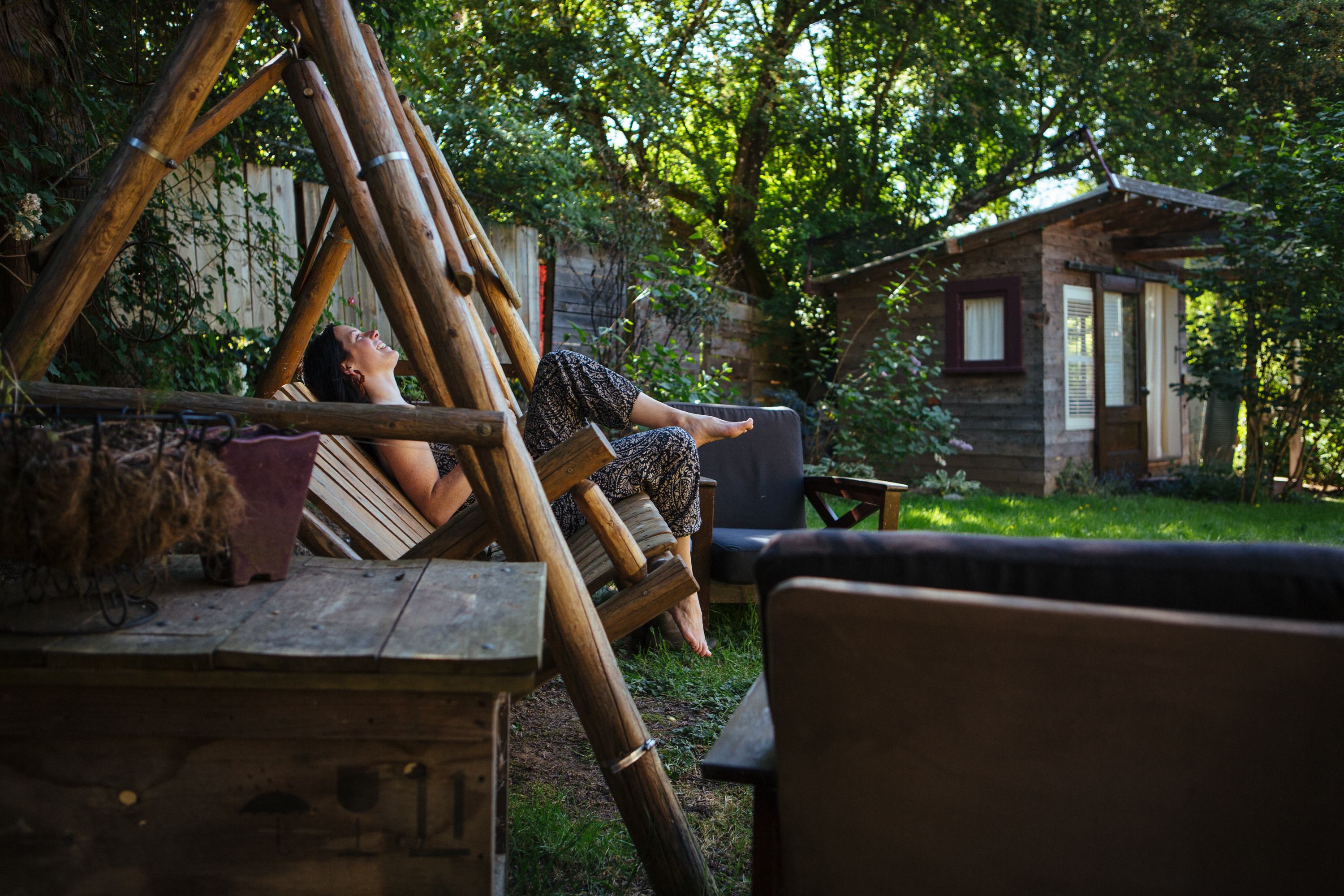 Wooden swing in the backyard, room for 2 or 3.