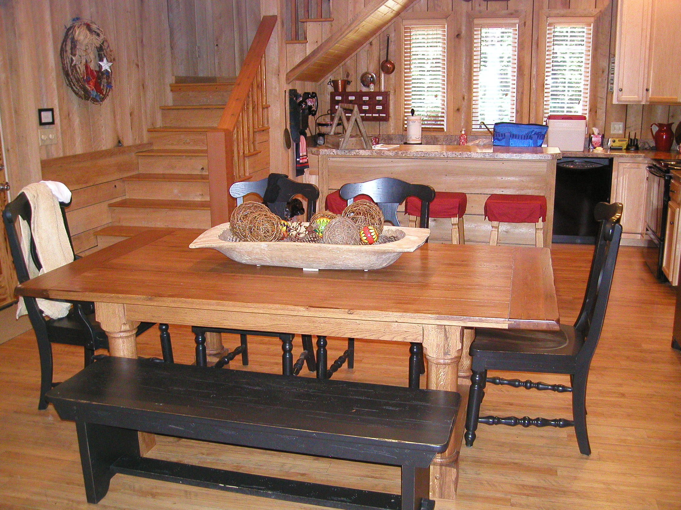 Dining table with the full kitchen in the background.  No need to cook outdoors unless you insist!