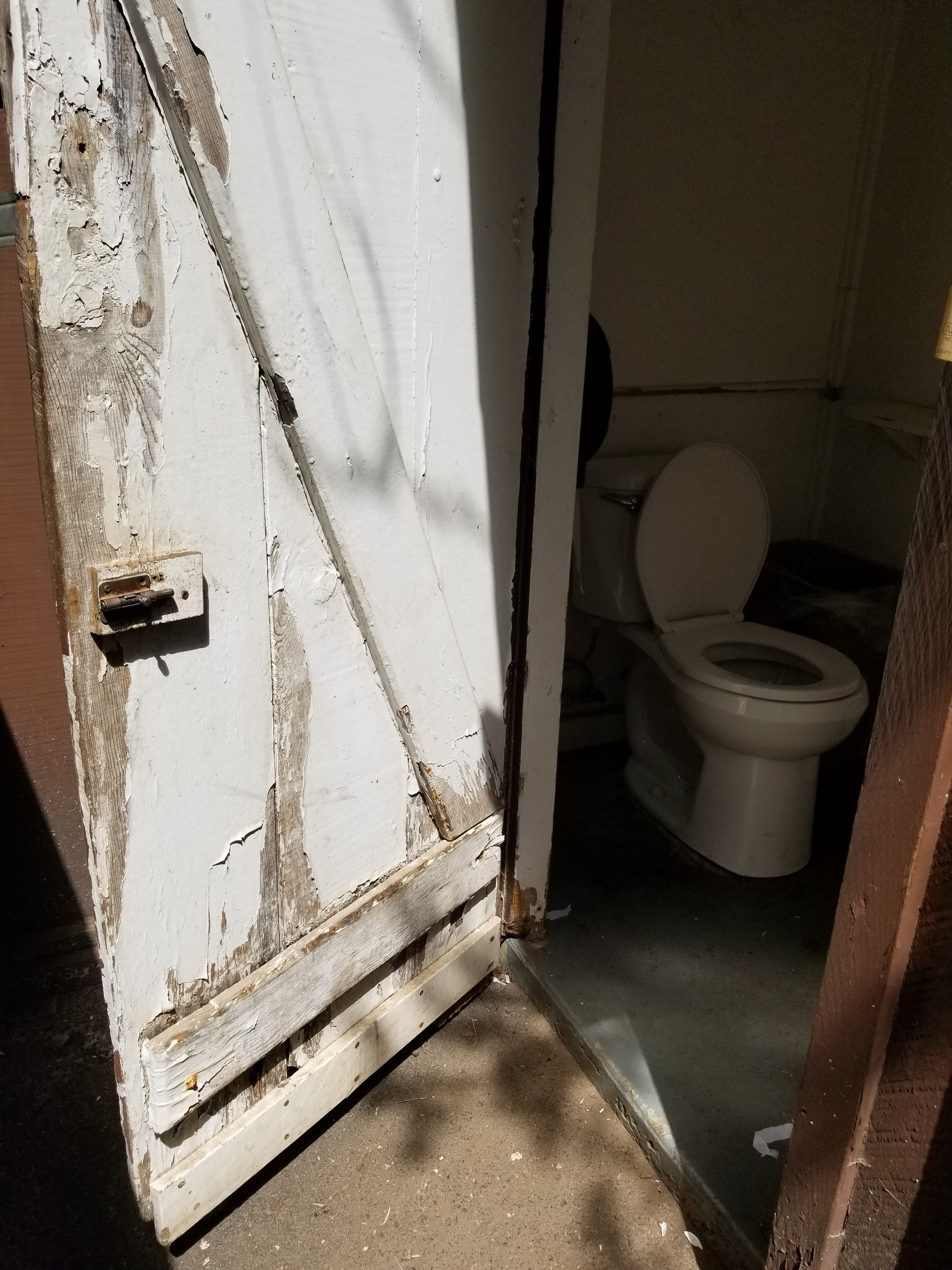 The restroom huts are rustic and really need new doors for better privacy. 