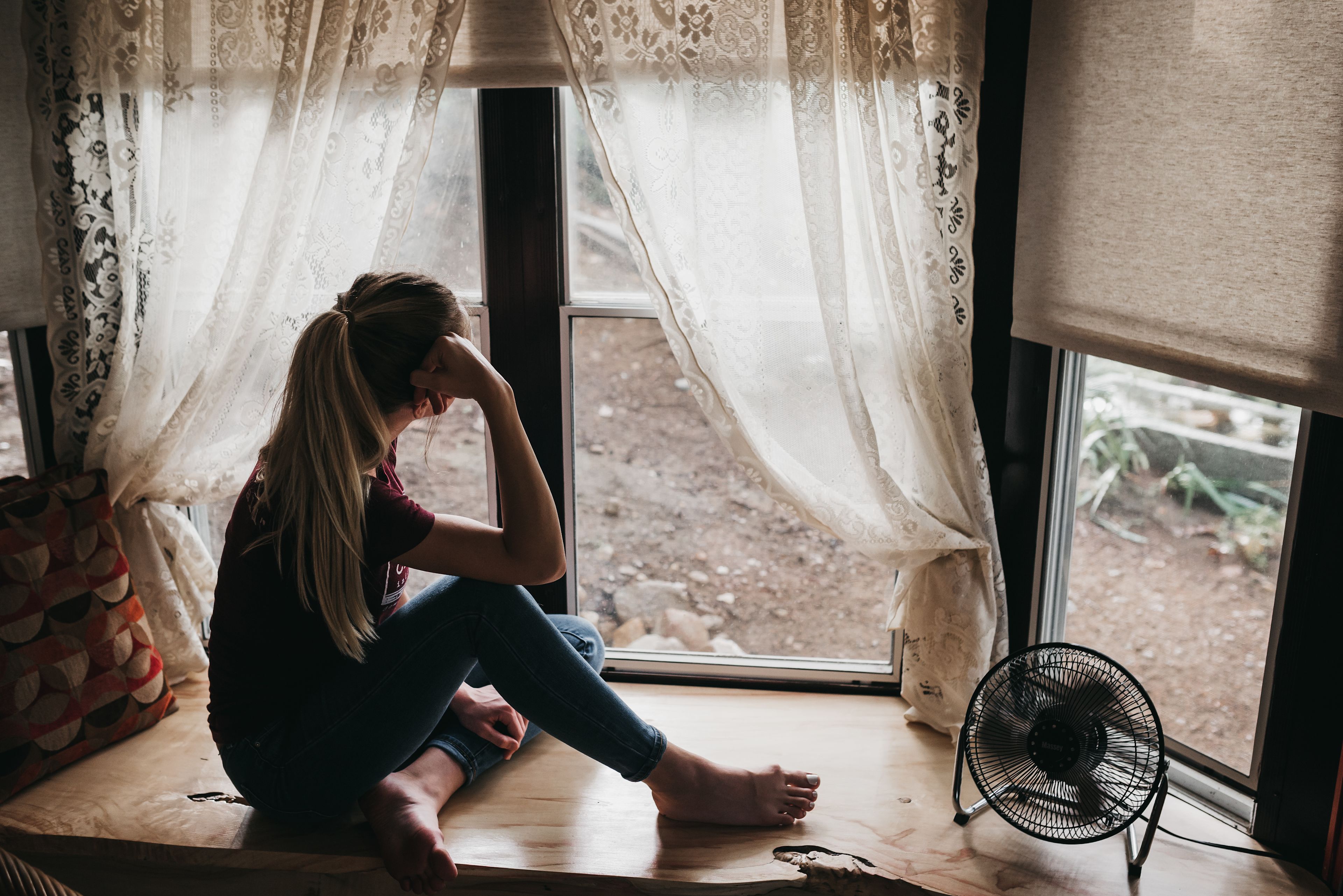 Wooden windowsill was a perfect place to watch the rain fall.