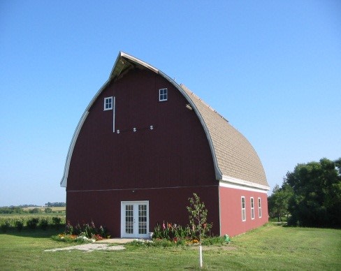 Our barn dormitory with 7 bedrooms, a lounge, men's and women's restrooms with showers, and kitchenette on the lower level.  The upper level has a full kitchen, a large dining hall/dance hall, and a stage.