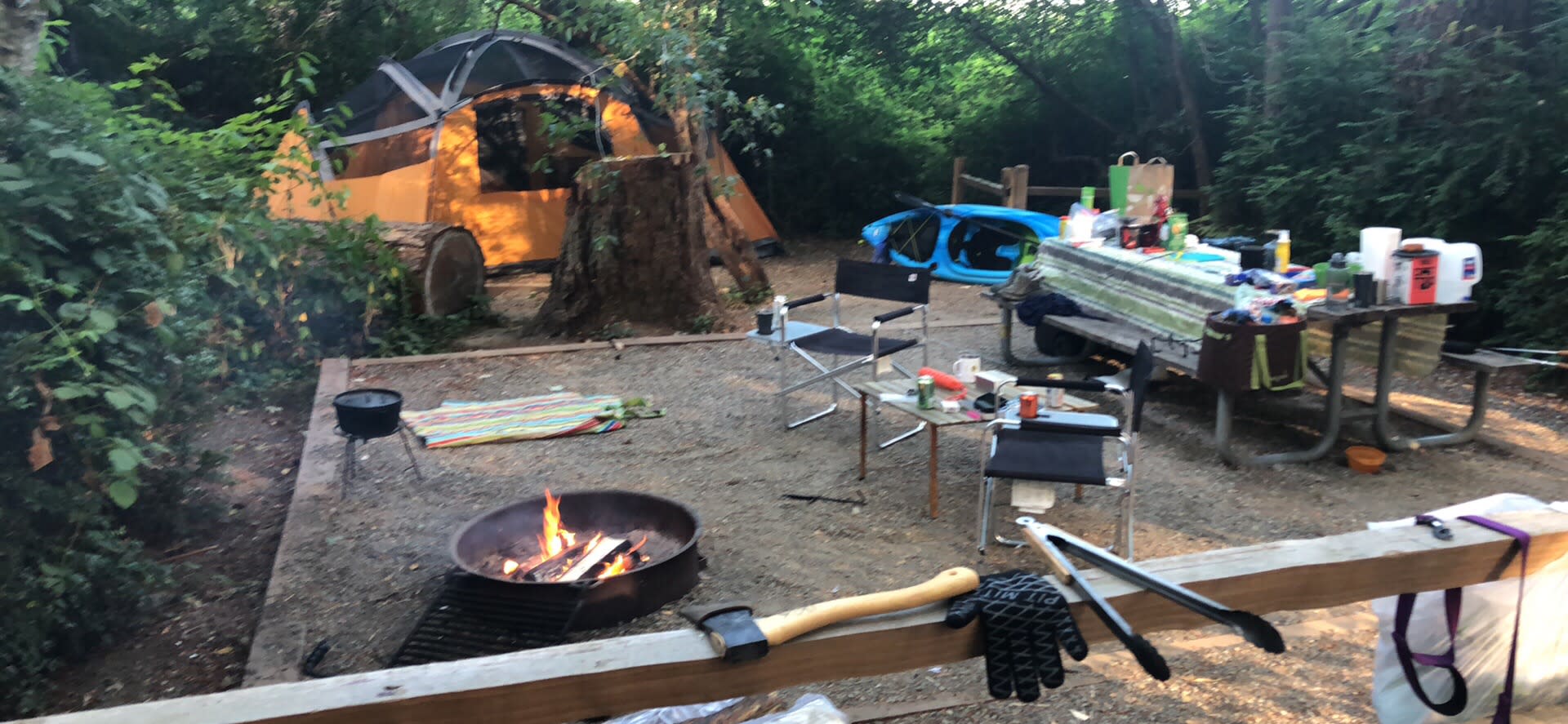Our setup with the tent in the back and the picnic table that is in each site. There were two of us plus our doggo, but would be comfortable with two more.