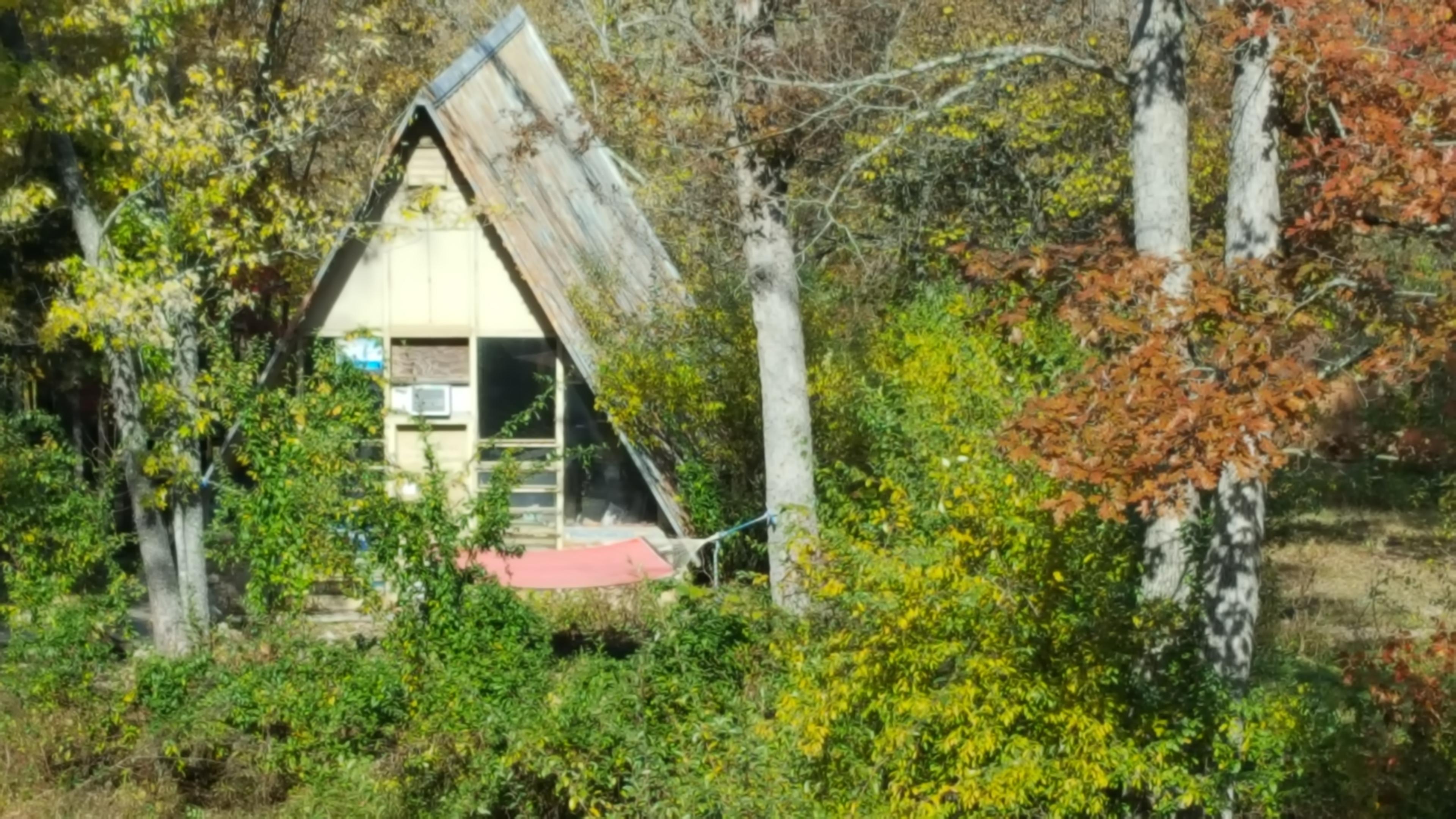 The A-Frame faces the south so wonderful sunshine beams into the space. The hammock and fire ring on the front side make the space a great place to hang out.
