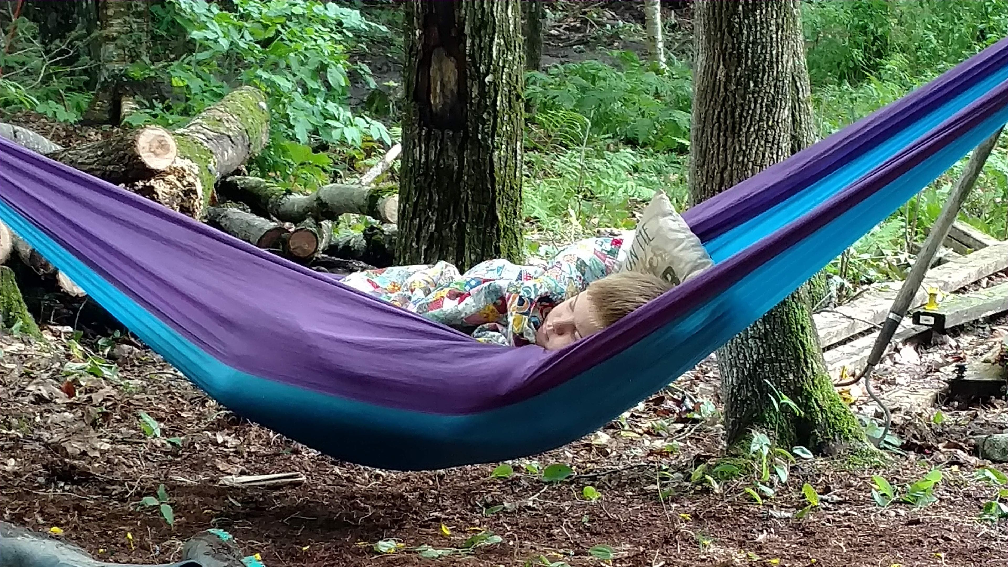 Cole, wasn't feeling well while we worked on one of the campsites... So he snoozed in the hammock.