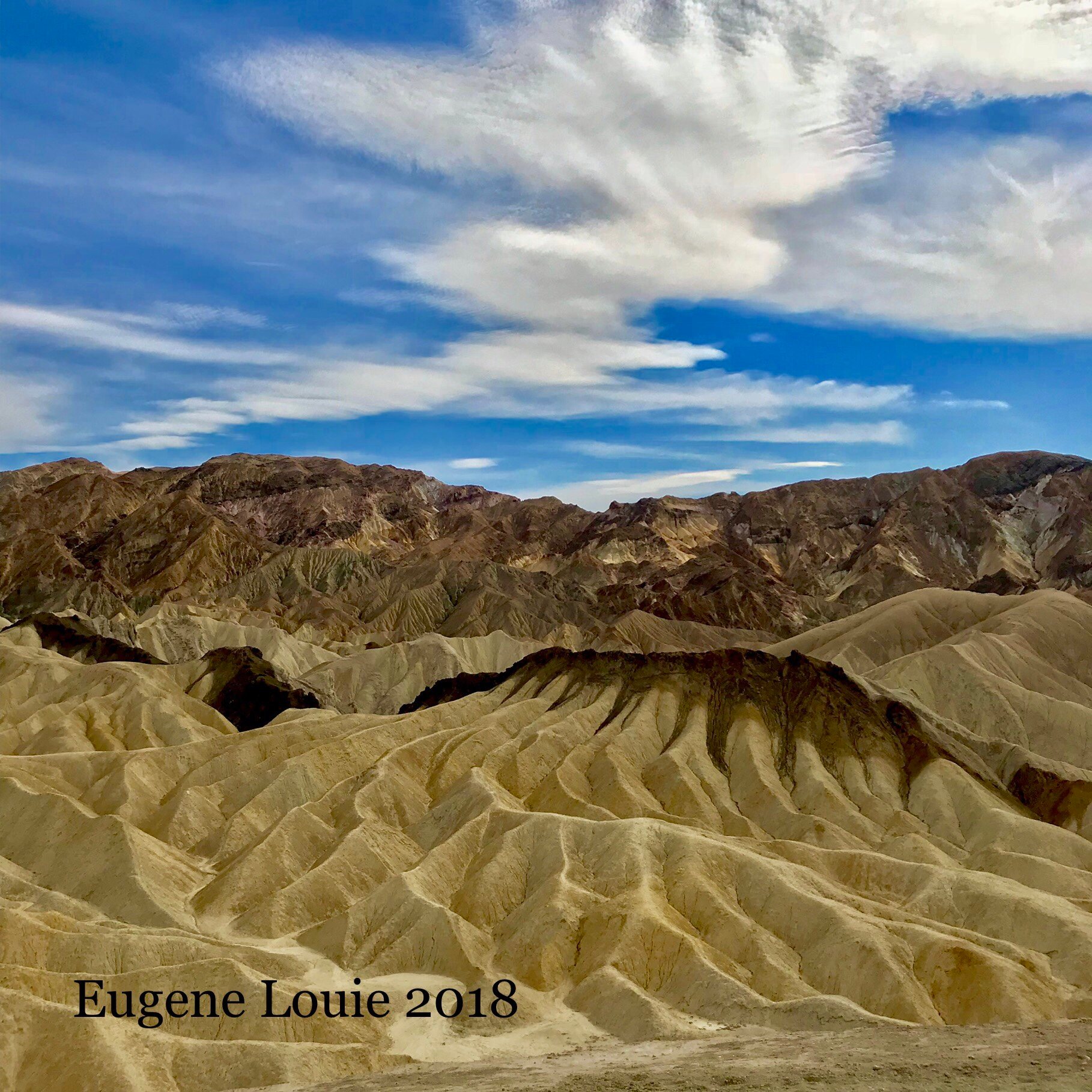This is what you will  see inudt by turning your tripod around aftrr shooting Zabriskie Point, Death Valley’s iconic symbol. Too many photographers drive hundreds of miles to take a picture of a famous scene, but doing a simple about face gives you more.