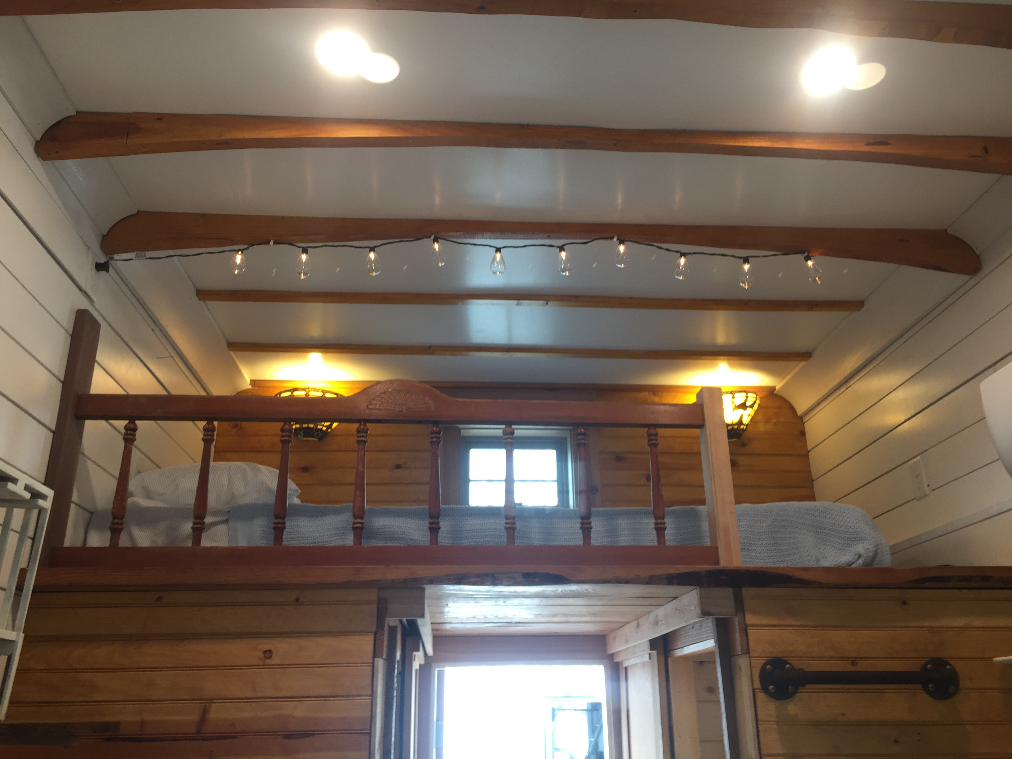 Rough hewn beams and crisp white shiplap provide an expansive feel!