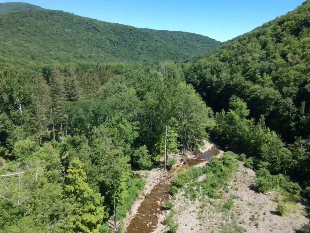 Drone picture of creek in front of camp