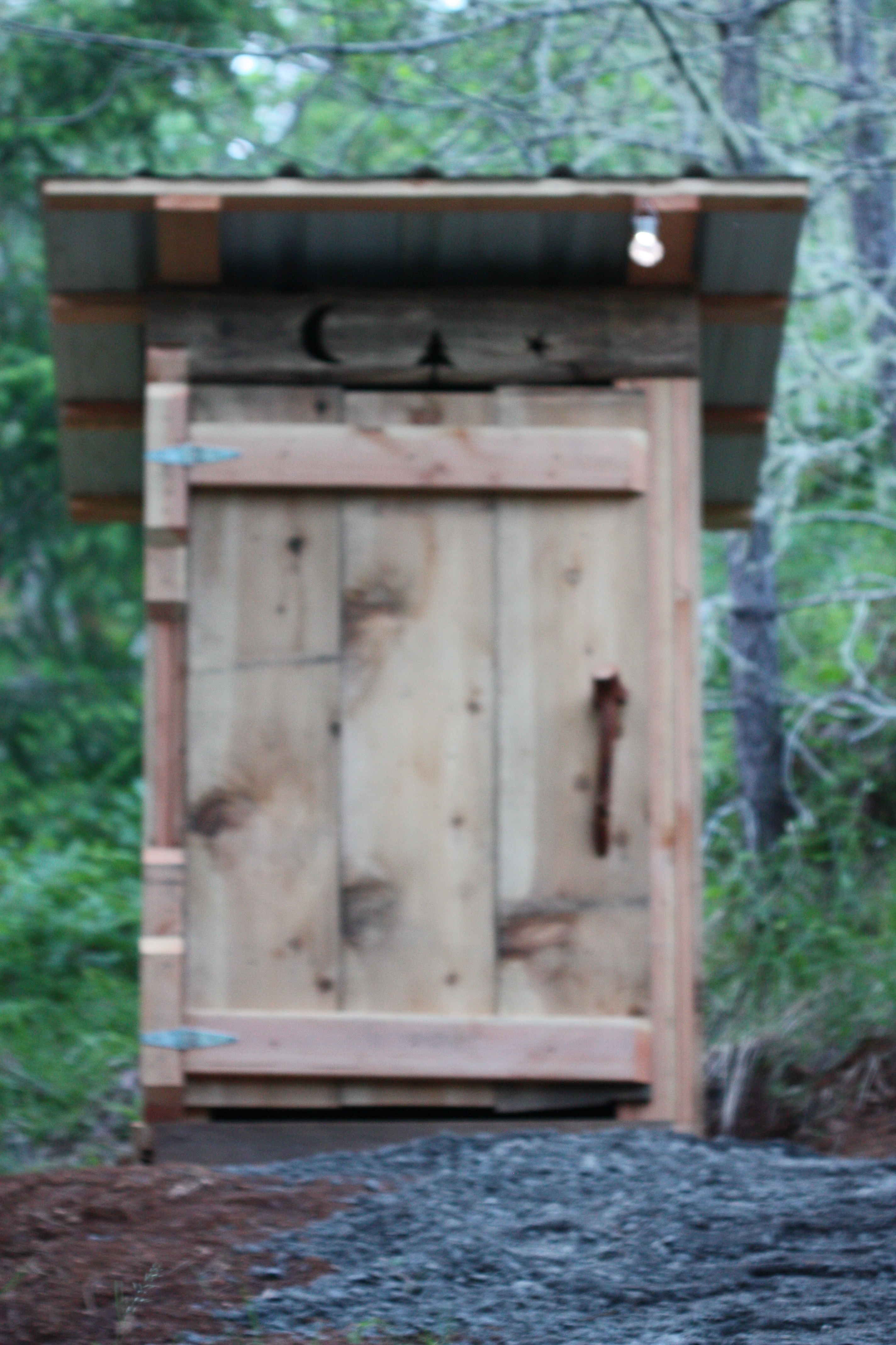 The outhouse is located between two sites.
