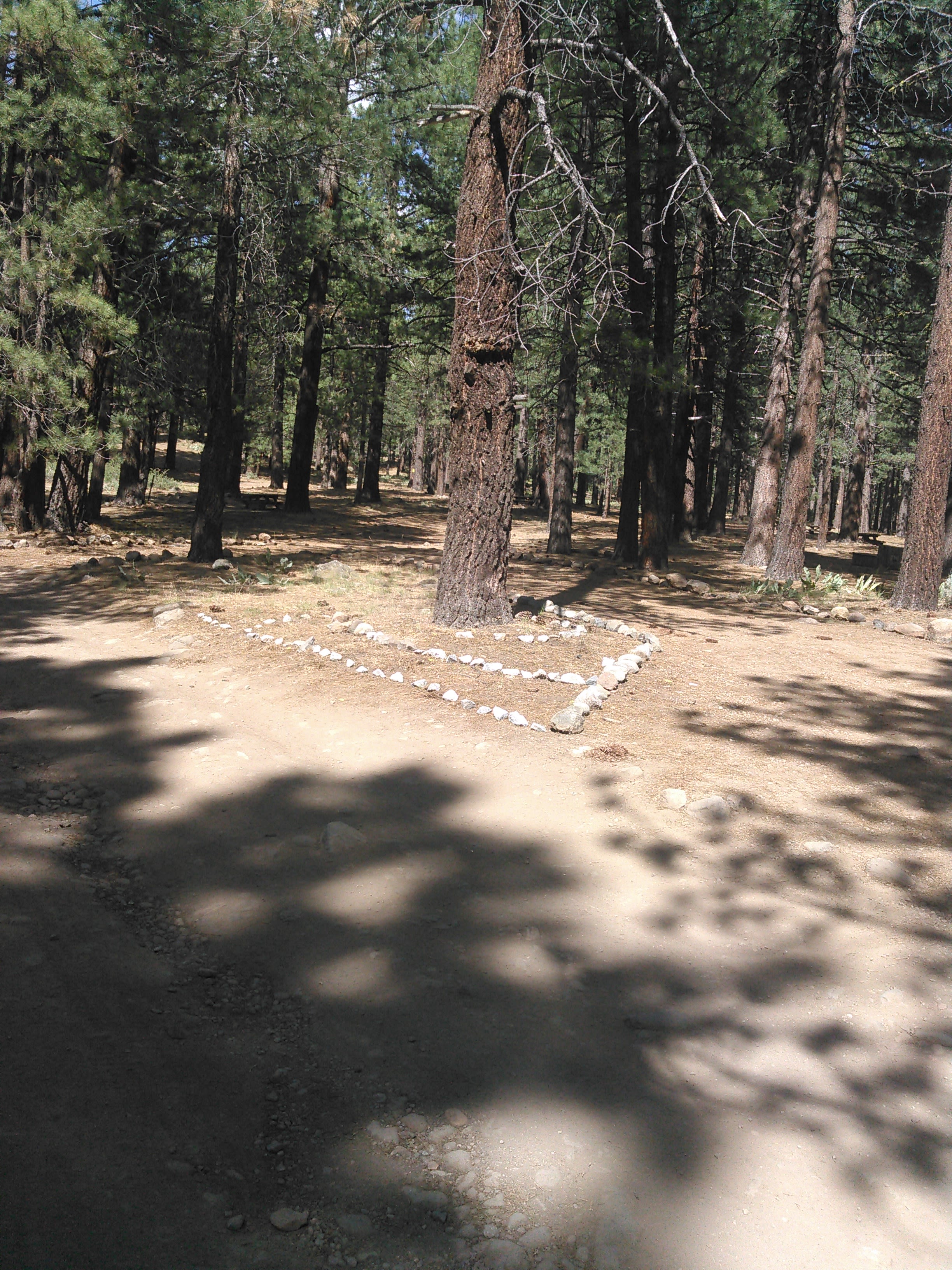 Camp Host Andrew Blash refurbished the camp and made rock designs 