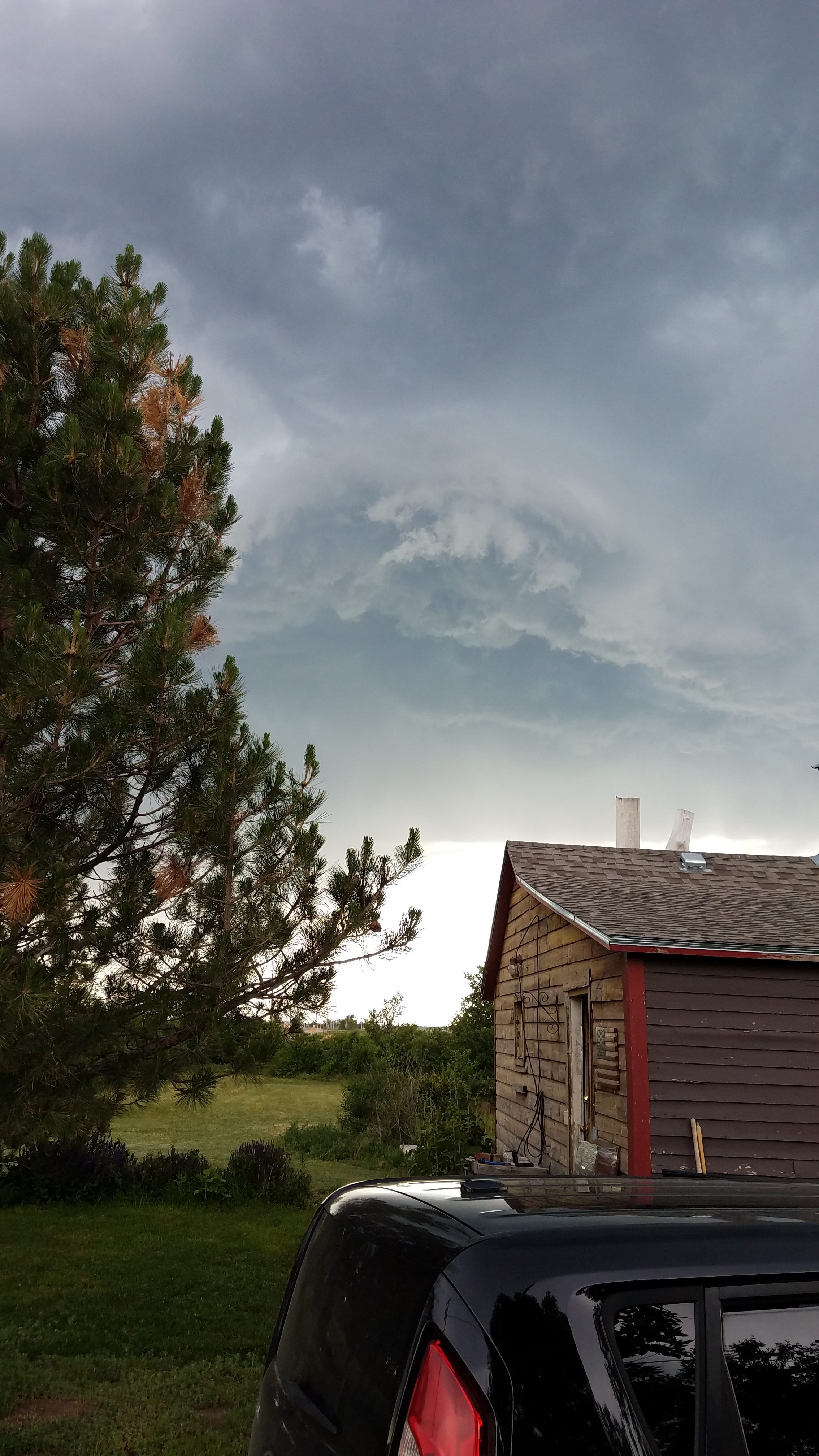 Clouds rolling in over the cabin.