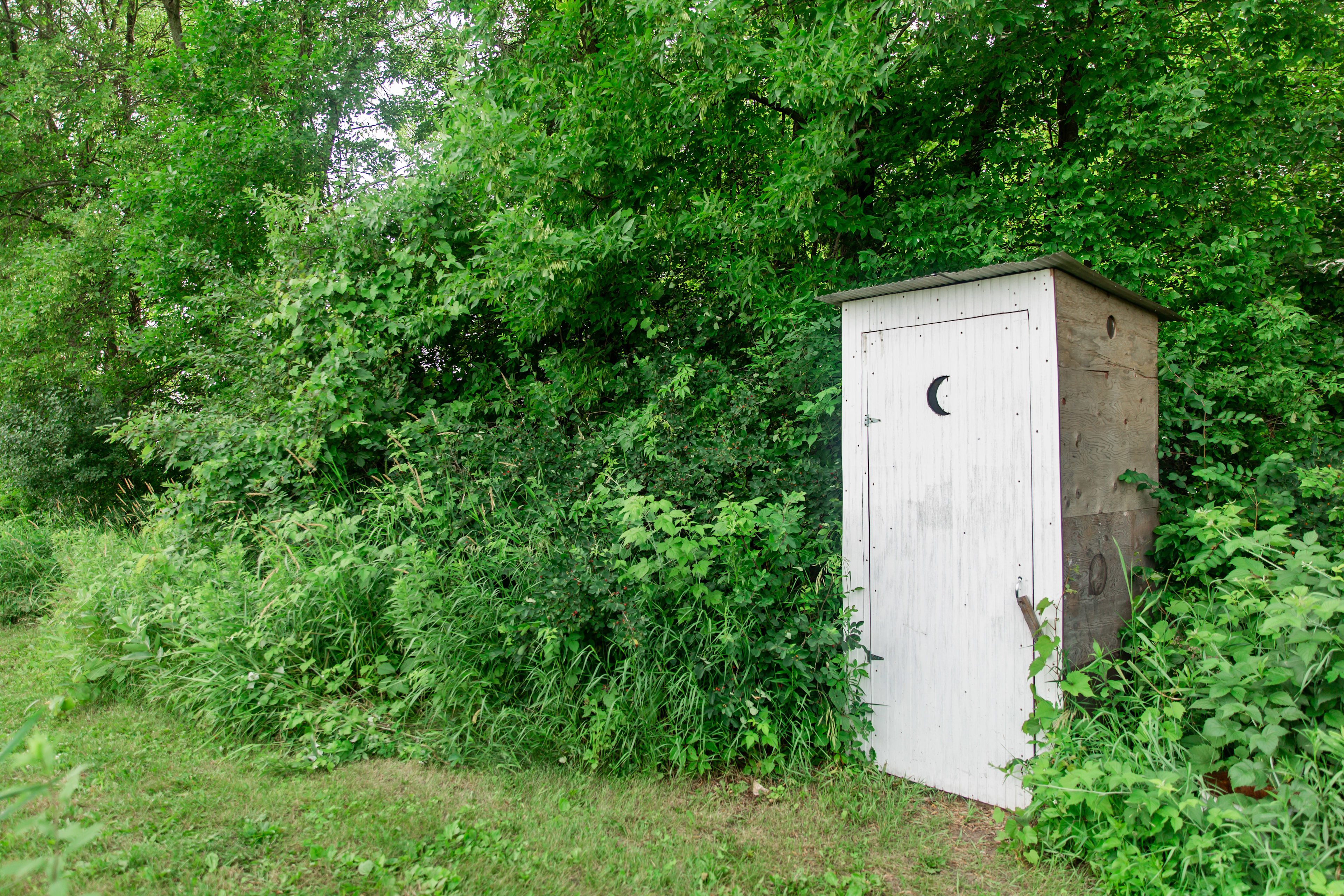 The outhouse has a composting toilet and cute classic design.