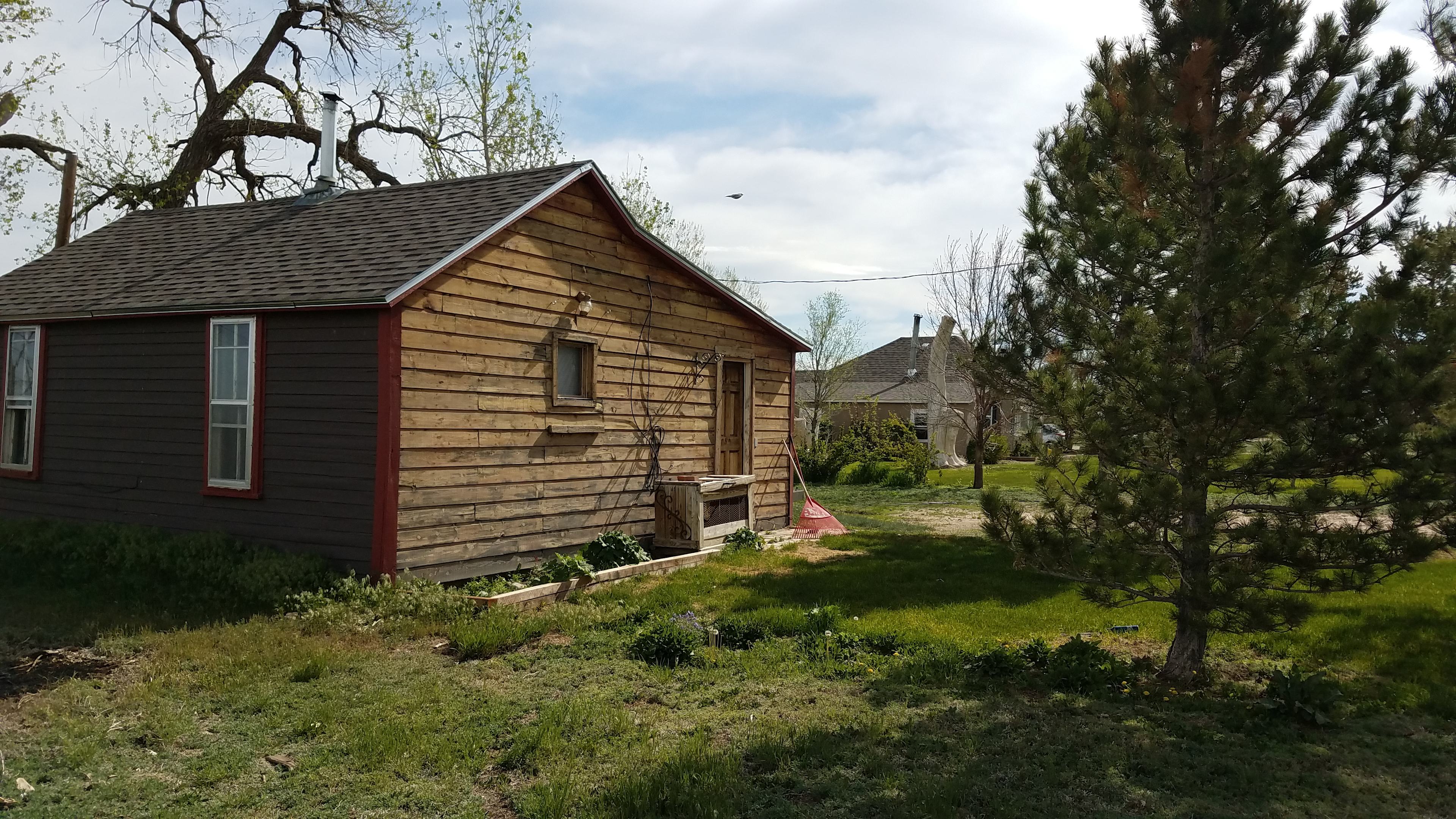 This old cabin was already here in 1909 when the other house was built