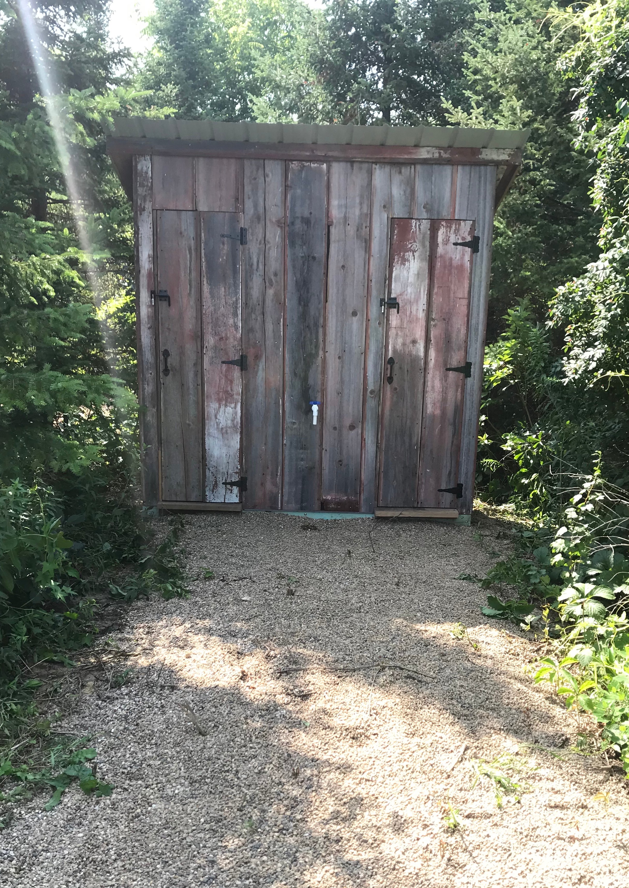 supplies, water, and outhouse